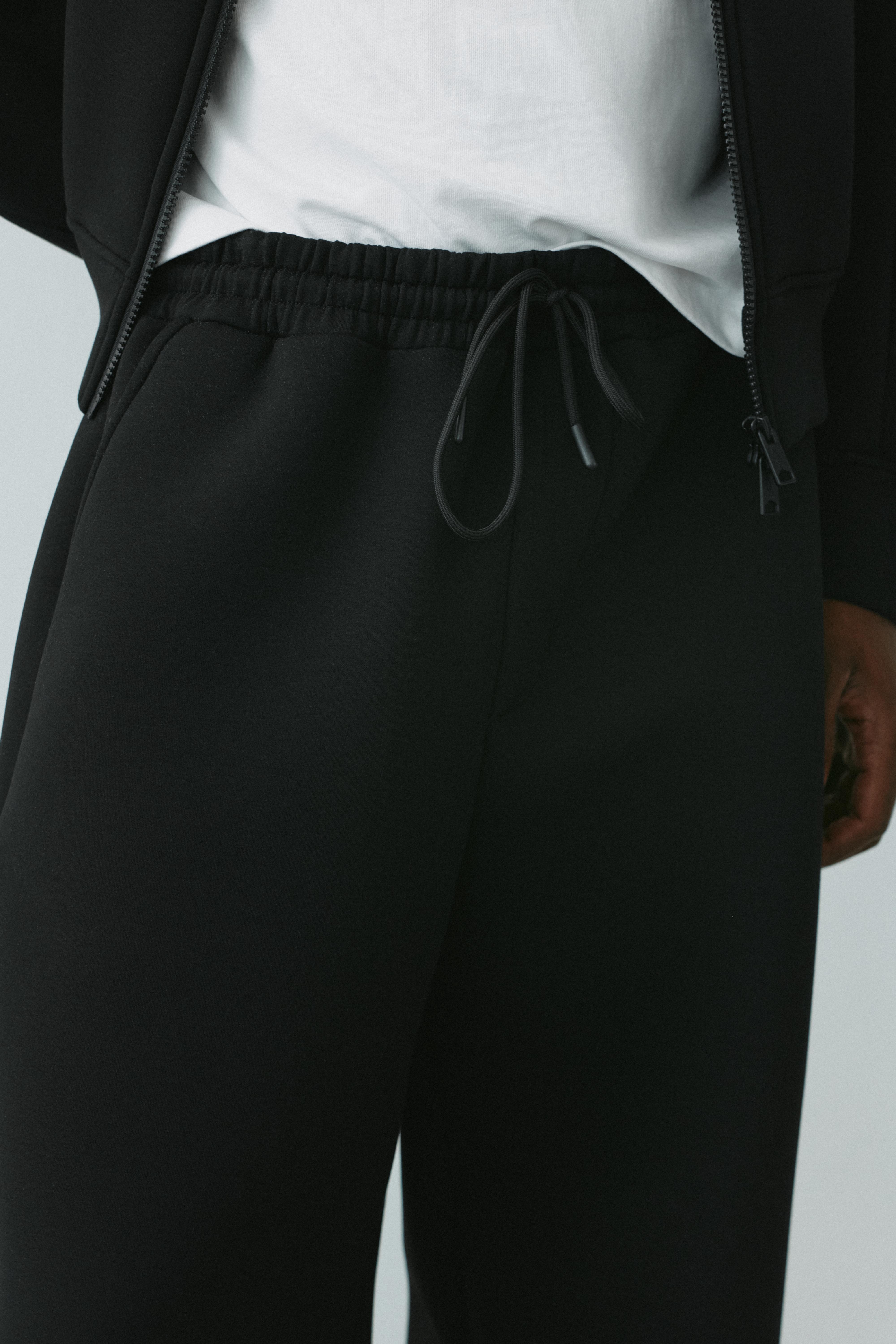 Neoprene-effect baggy trousers — Black