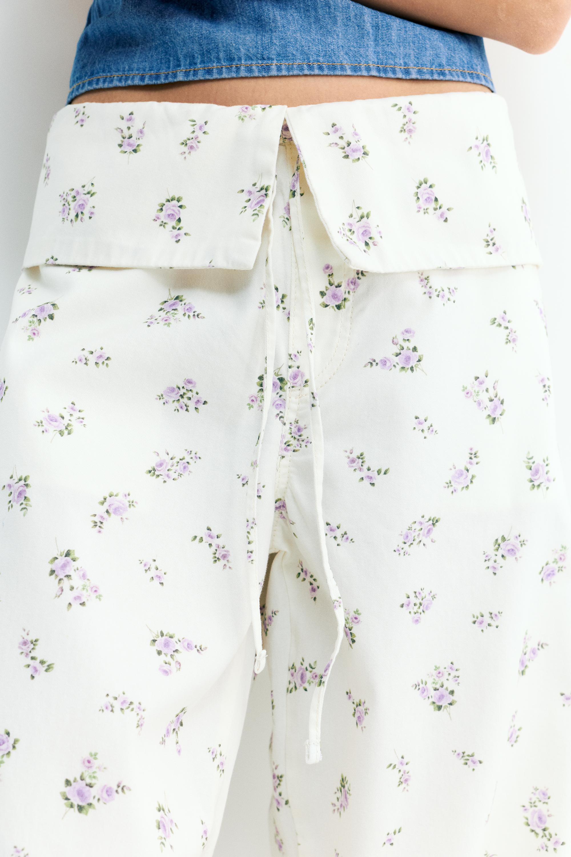 Floral trousers with turn-up waist — White
