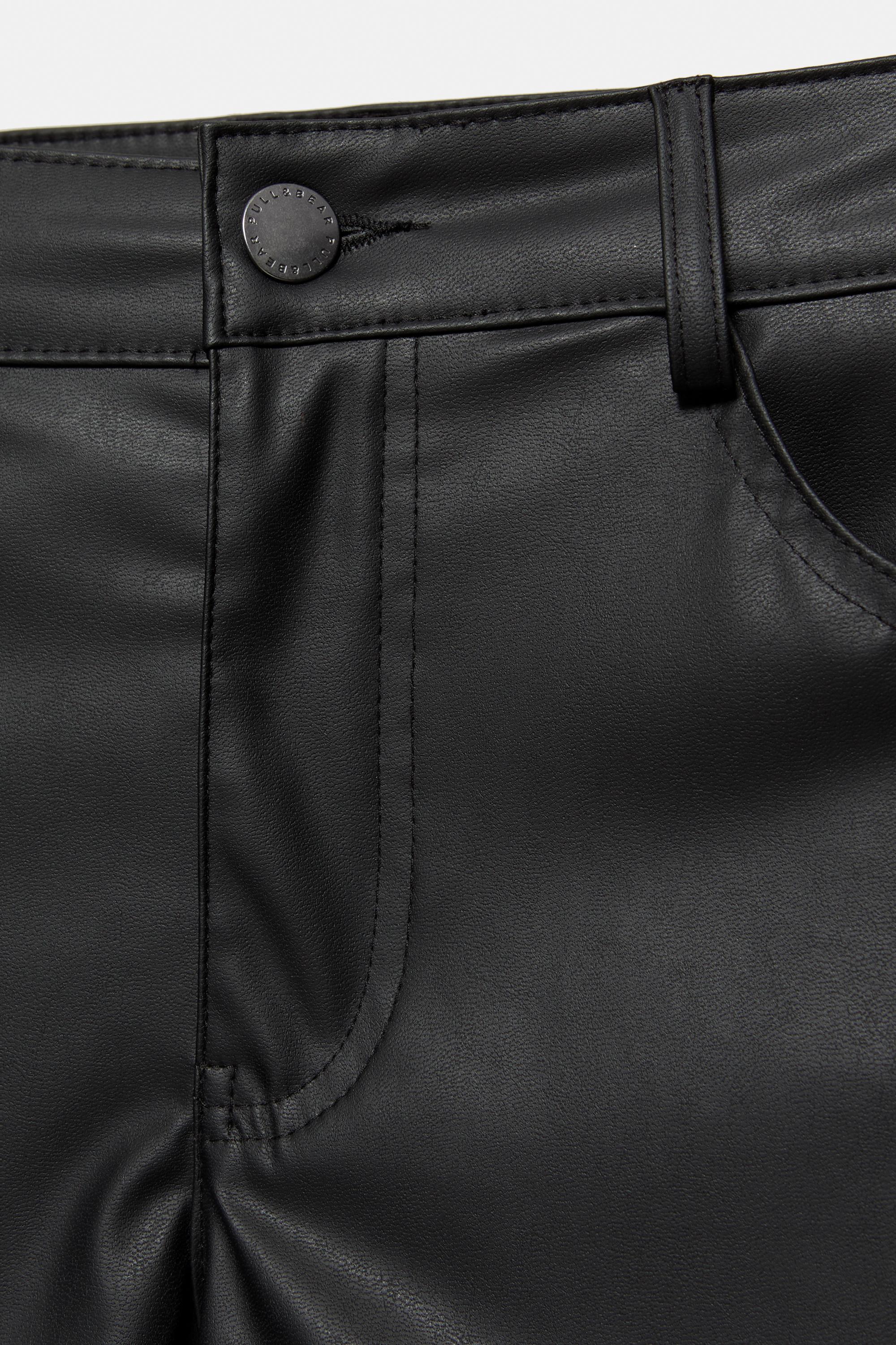 Studded faux leather mini shorts — Black