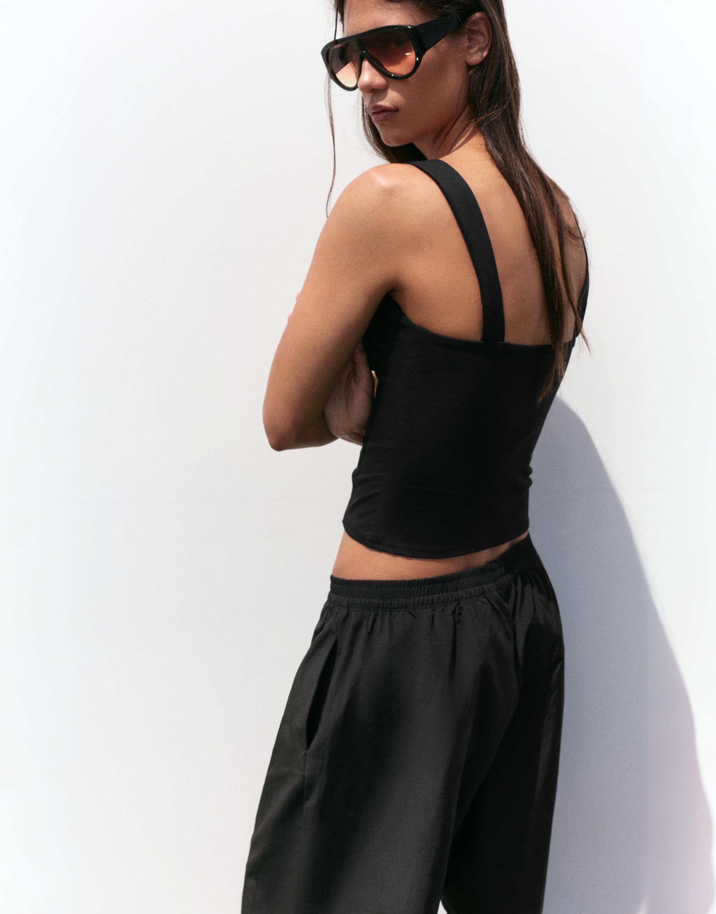 Strappy corsetry-inspired top — Black