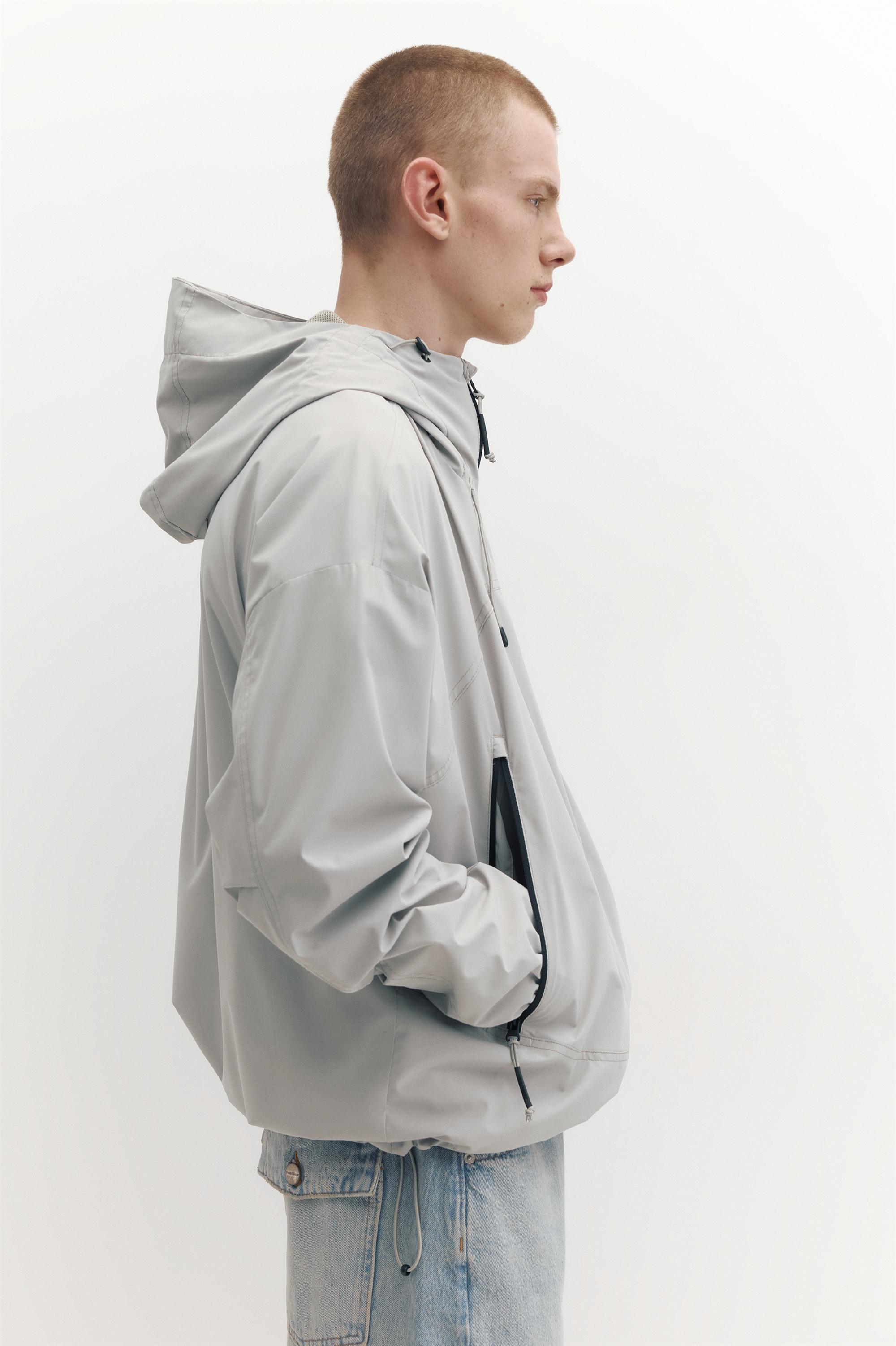 Lightweight hooded raincoat — Pale marl