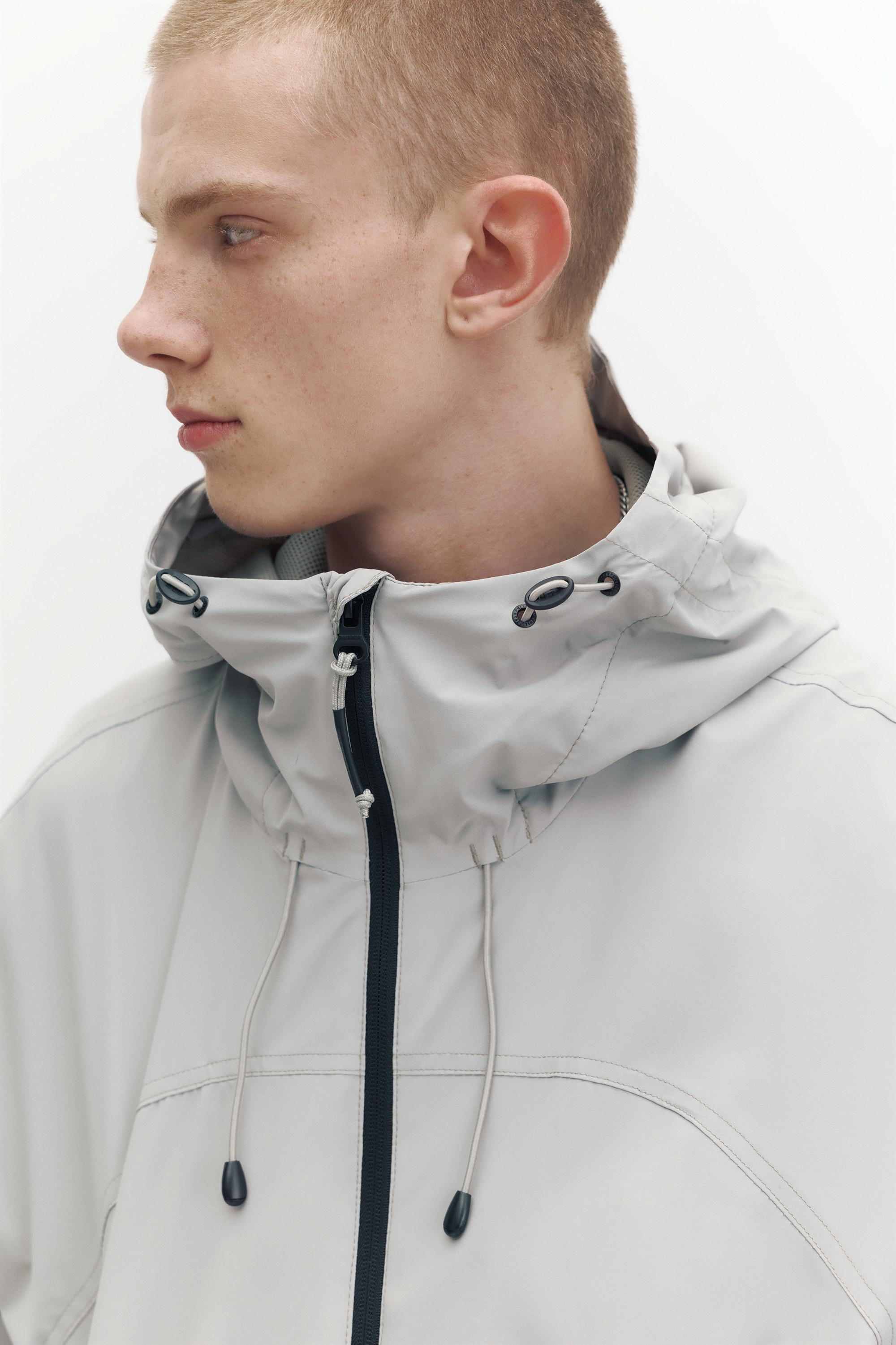 Lightweight hooded raincoat — Pale marl