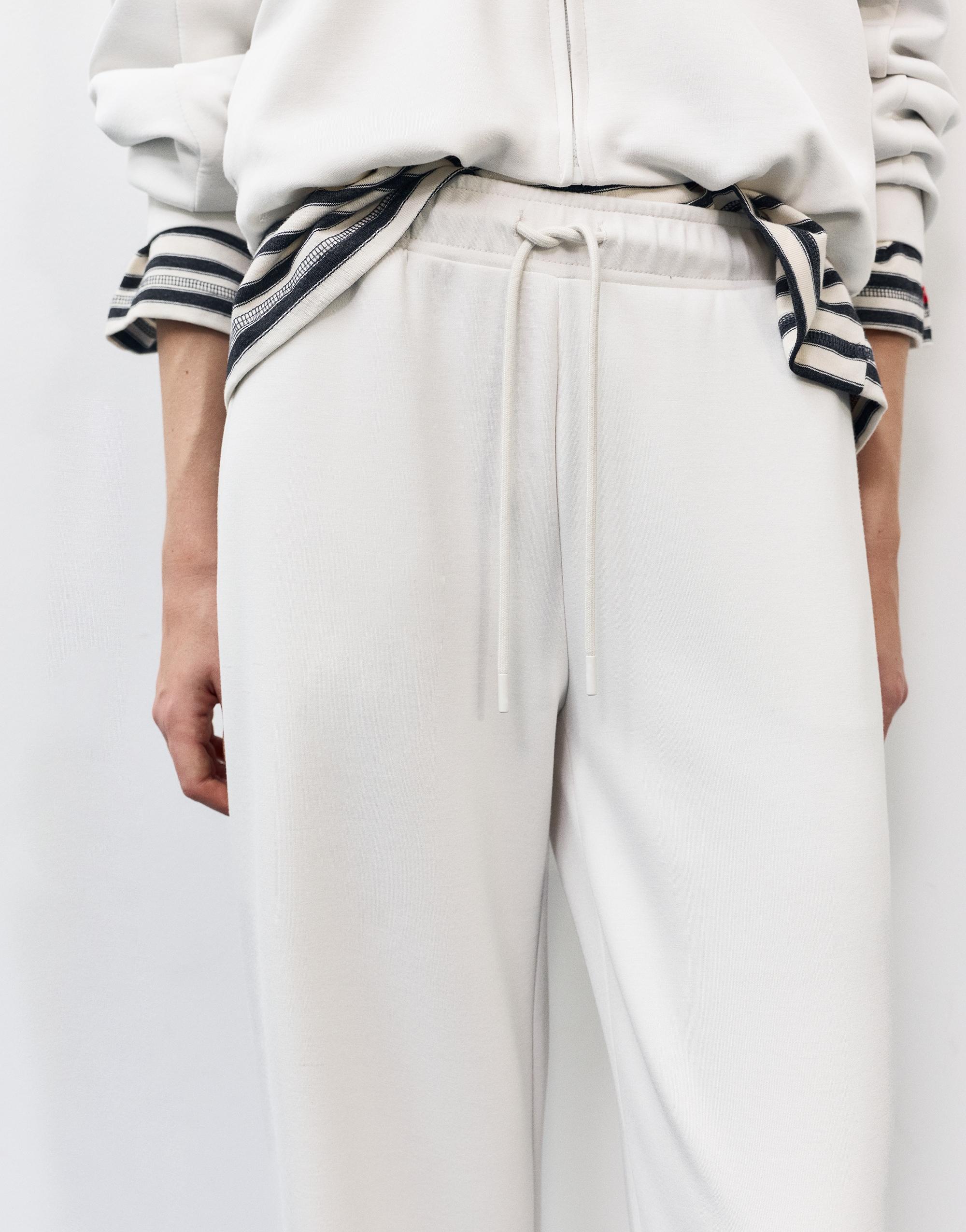 Soft-touch wide-leg trousers — Ecru
