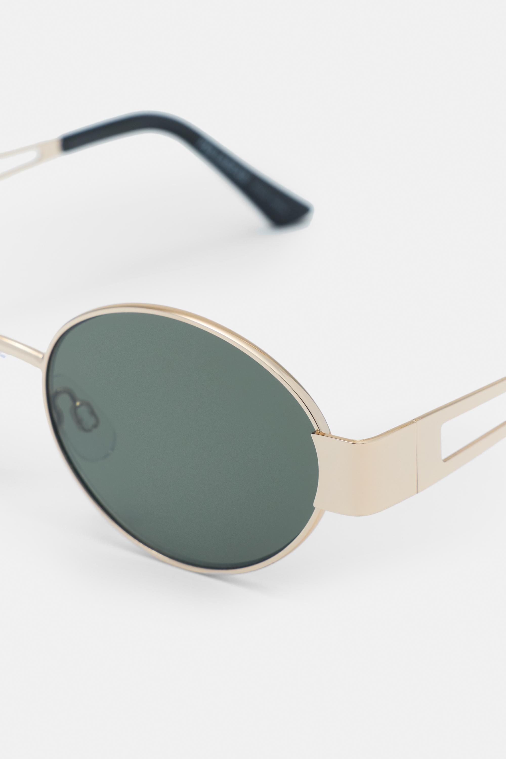 Metallic oval sunglasses — Gold