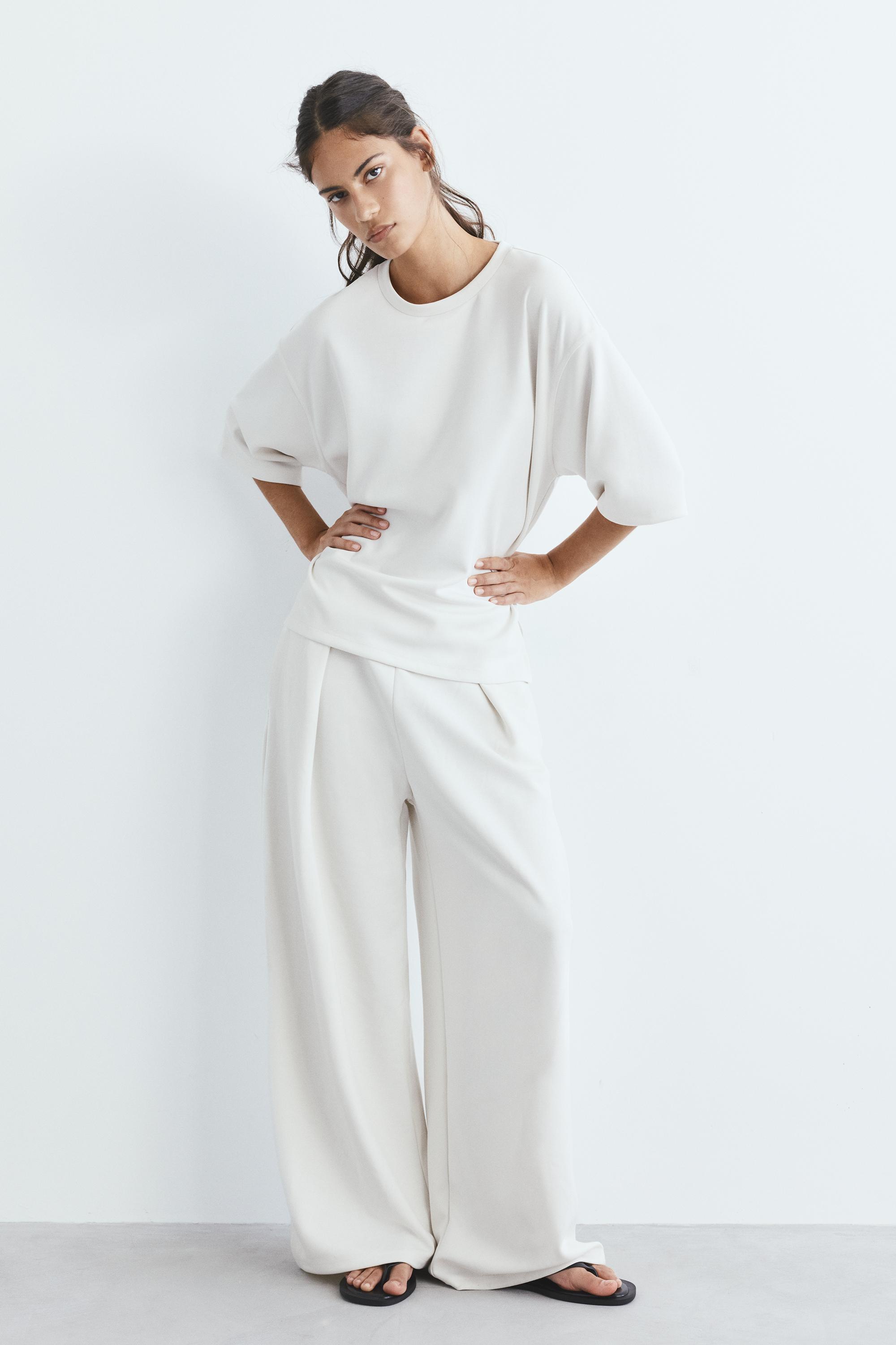 Soft-touch wide-leg darted trousers — Ecru