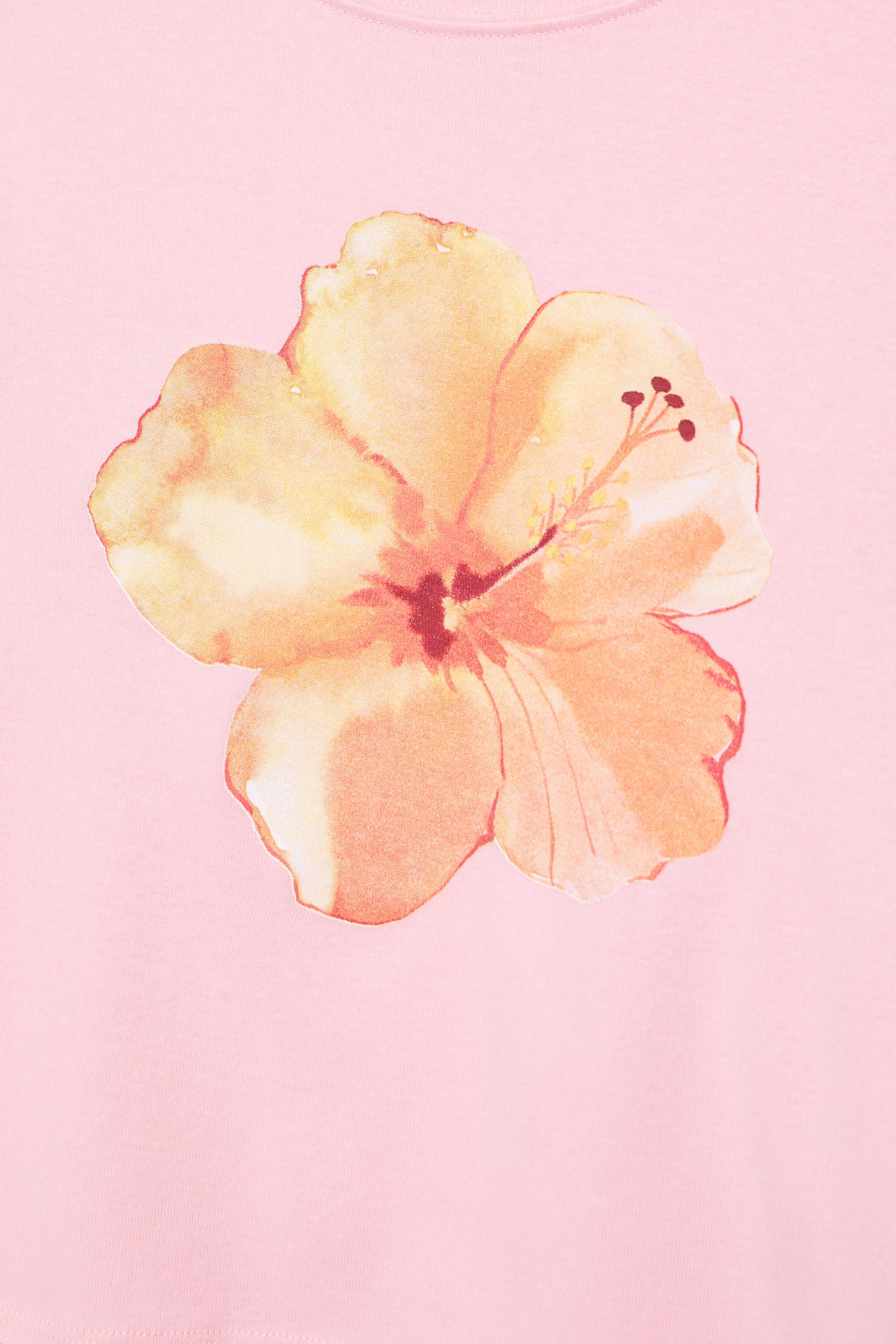 Pink hibiscus flower graphic T-shirt — Pale pink