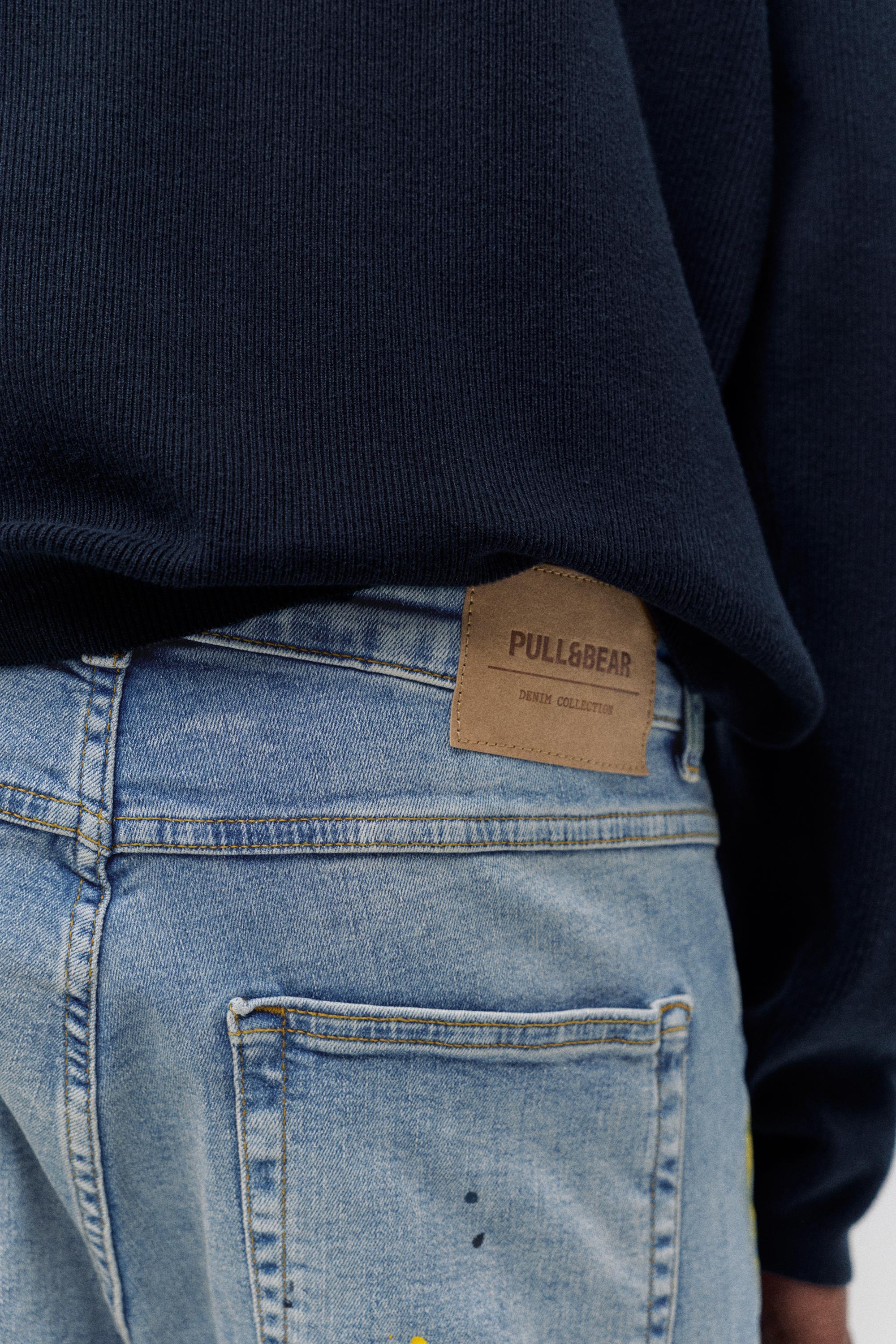 Paint splatter carrot-fit jeans — Medium blue