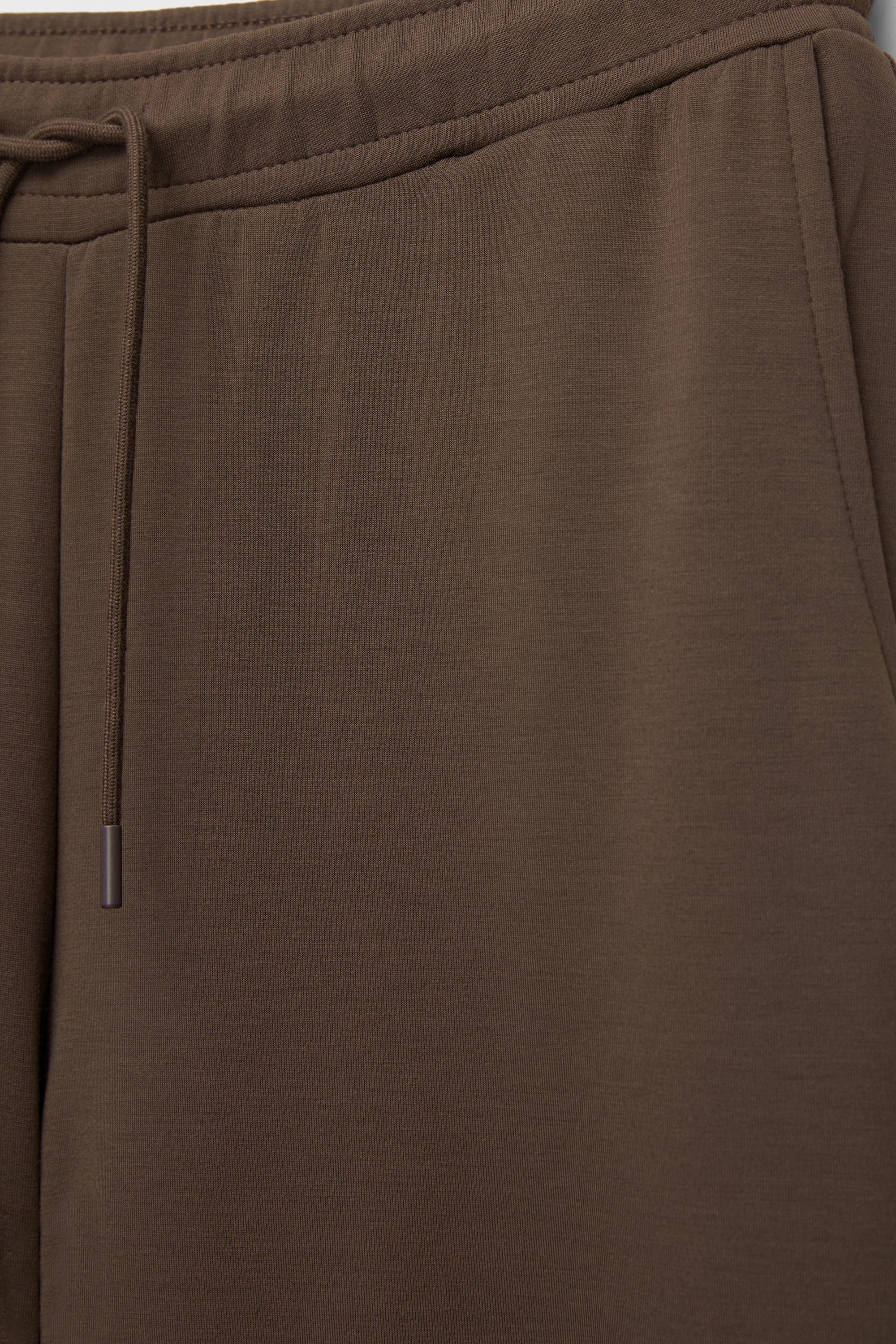 Soft-touch wide-leg trousers — Brown