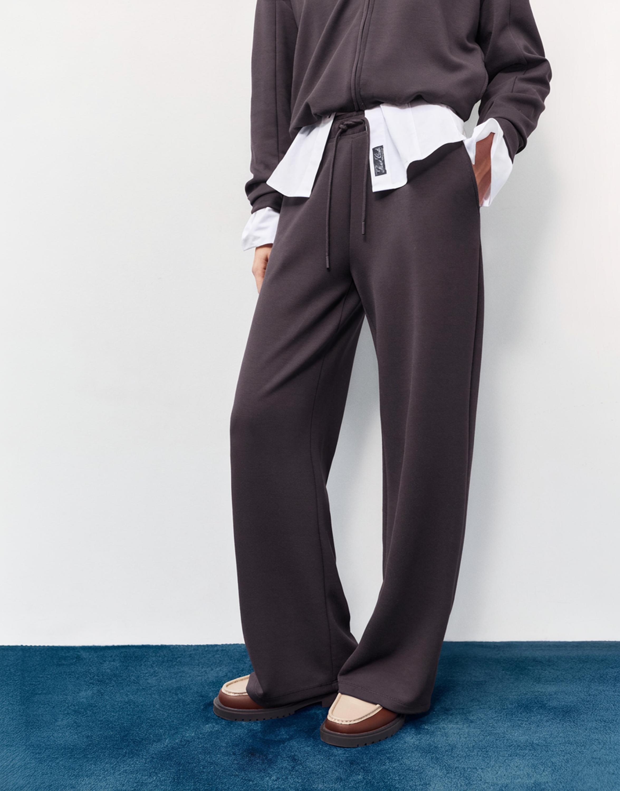 Soft-touch wide-leg trousers — Black