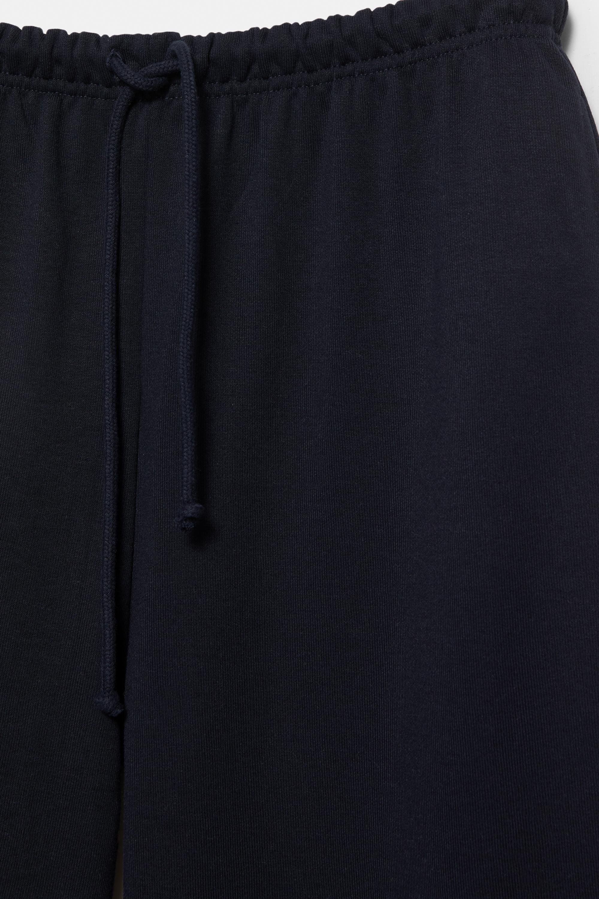 Wide-leg tracksuit bottoms with adjustable hem — Navy