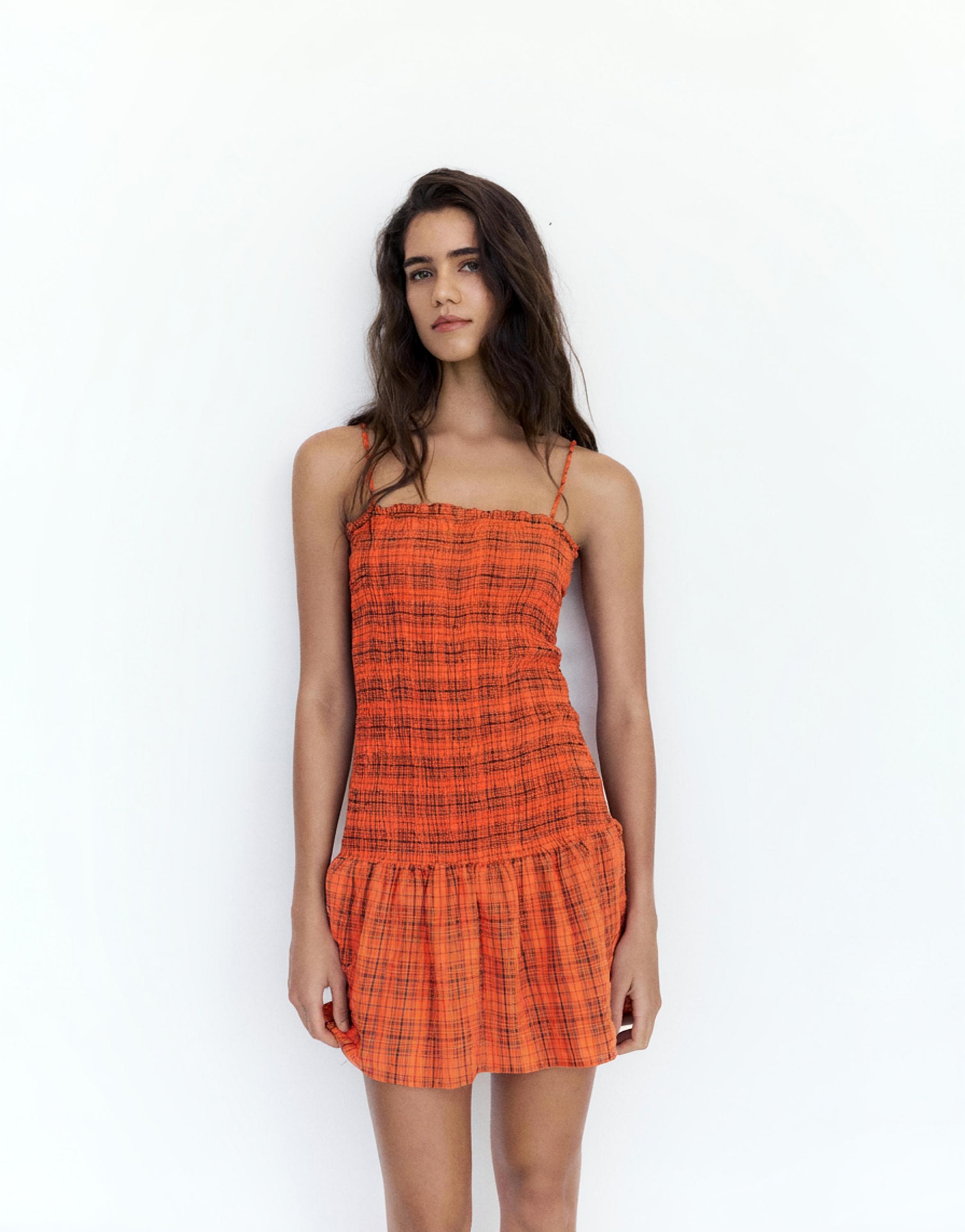 Check smocked dress — Red