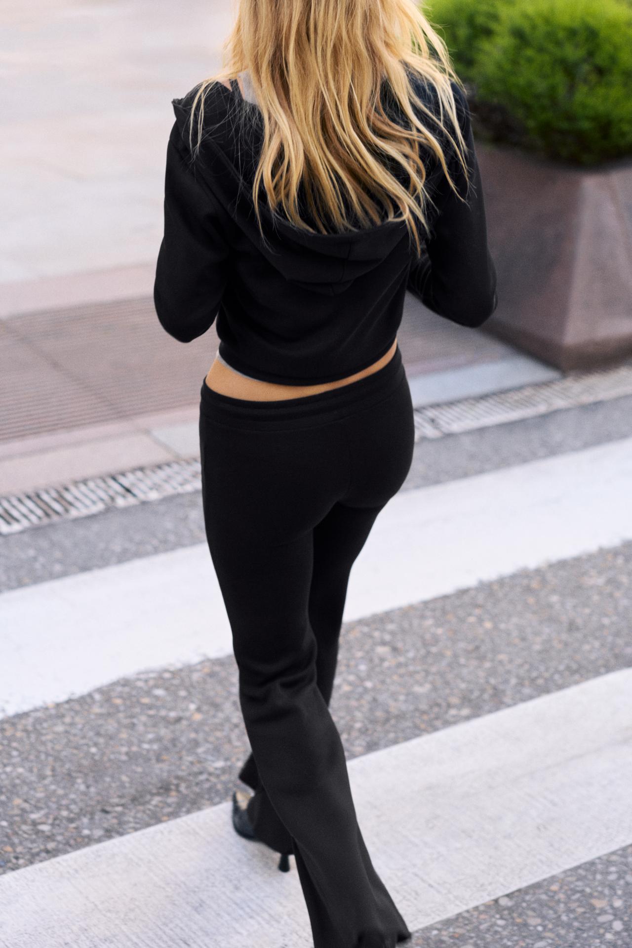 Soft-touch flared trousers — Black