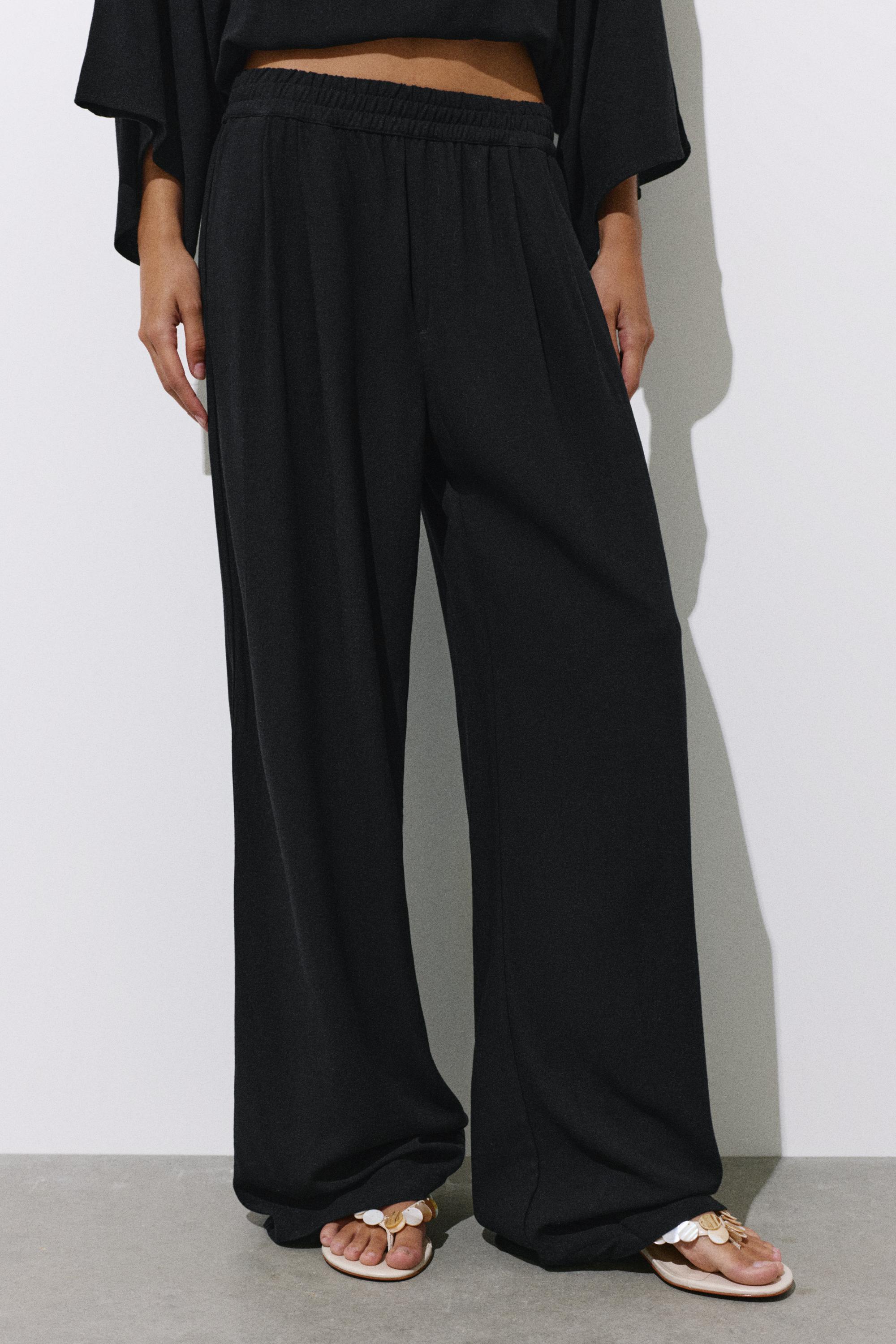 Flowing darted trousers — Black