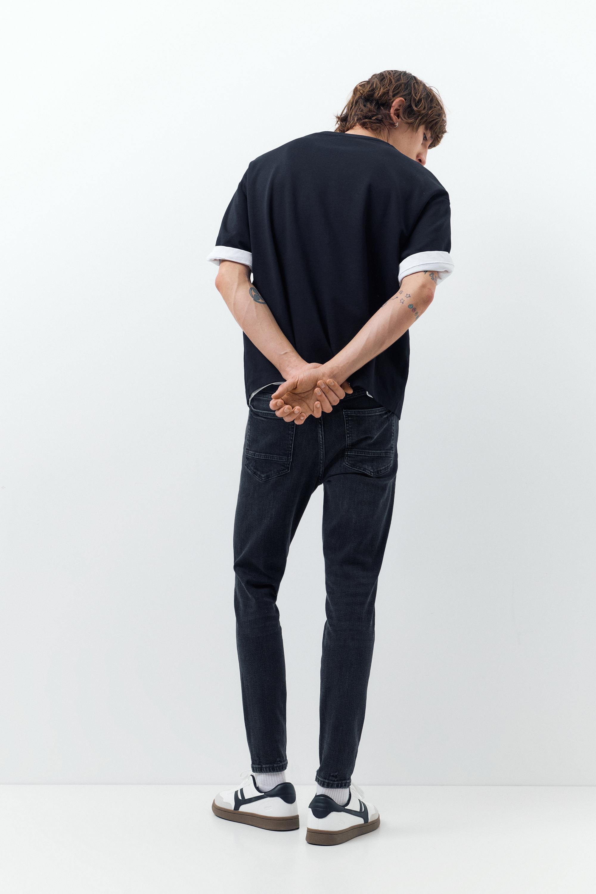 Ripped skinny jeans — Faded black