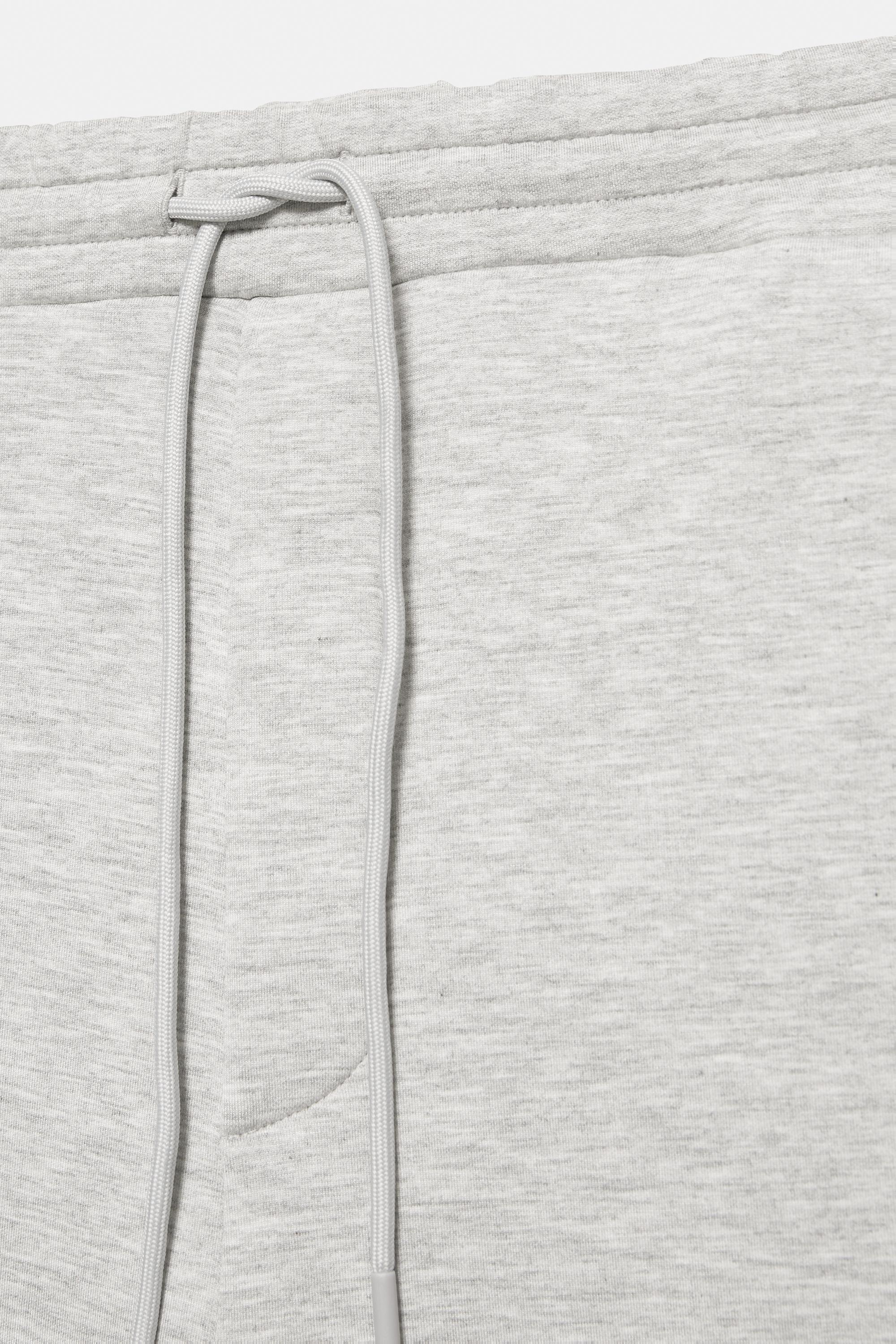 Neoprene-effect baggy trousers — Grey marl