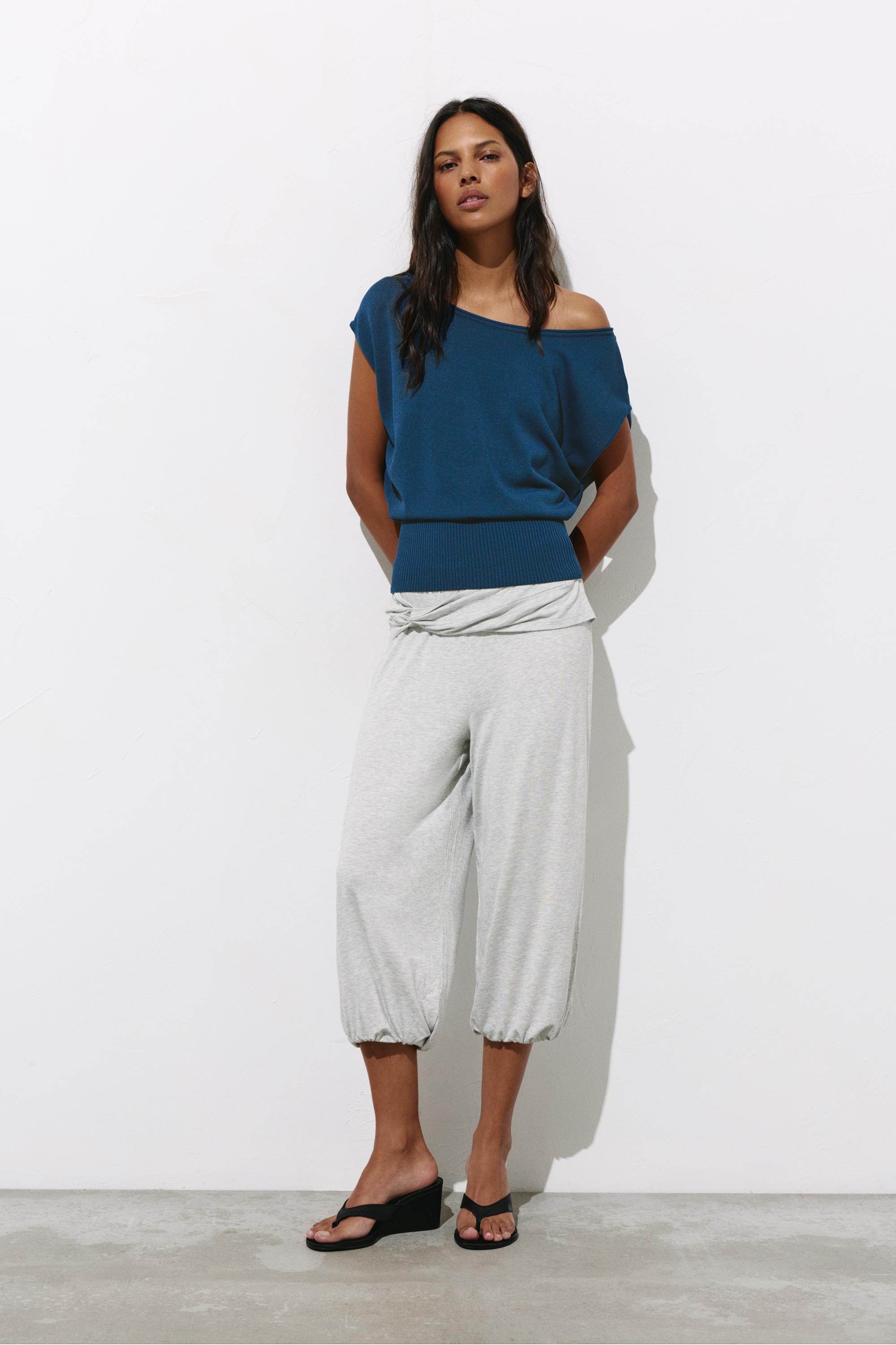 Short sleeve asymmetric knit top — Indigo
