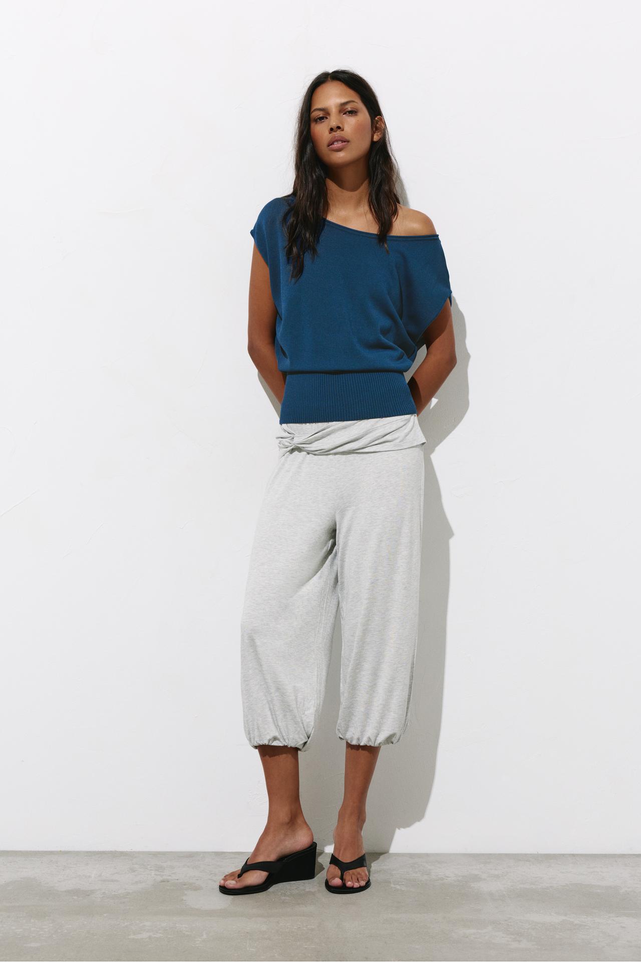 Short sleeve asymmetric knit top — Indigo