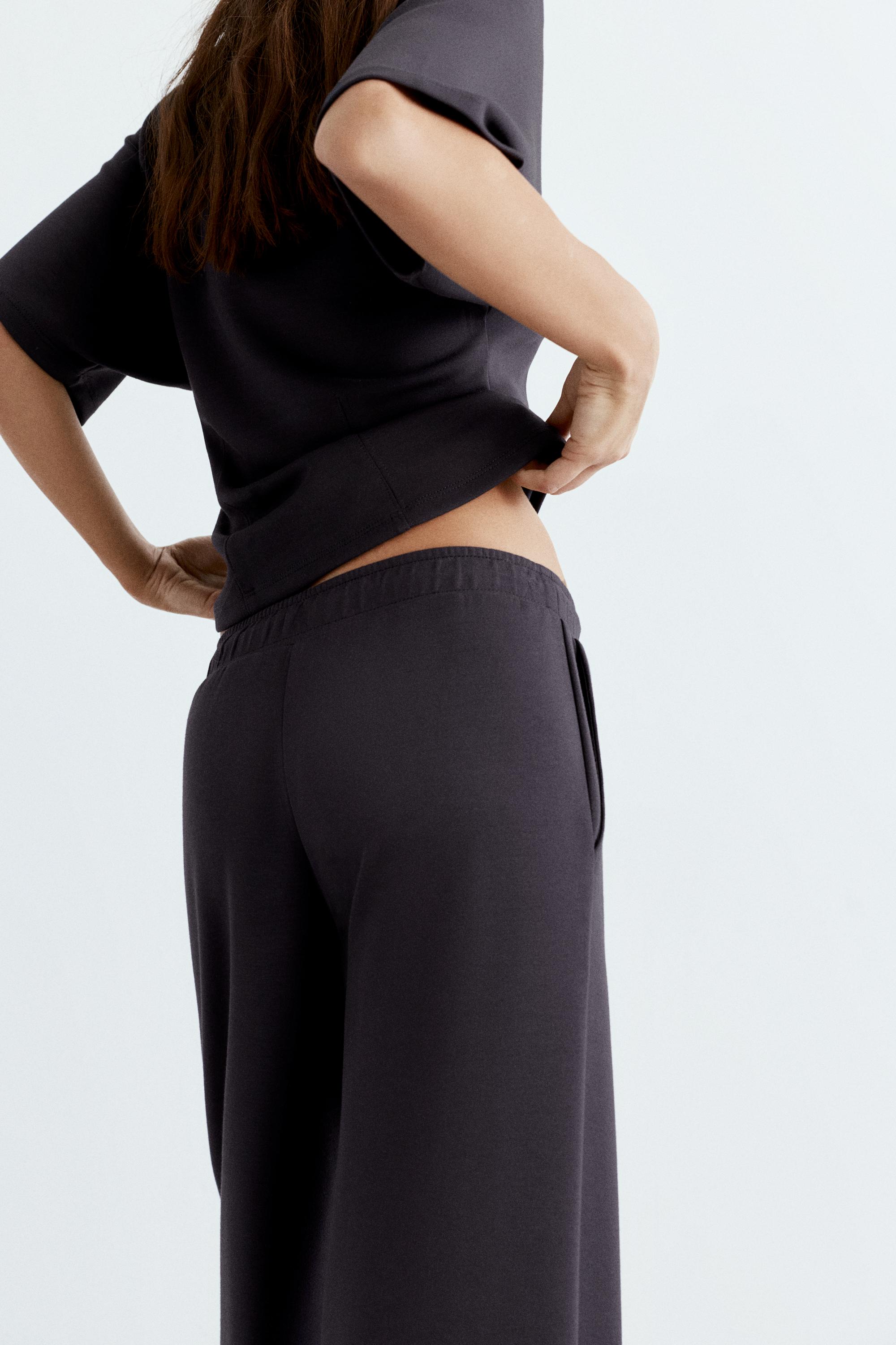 Soft-touch wide-leg trousers — Black