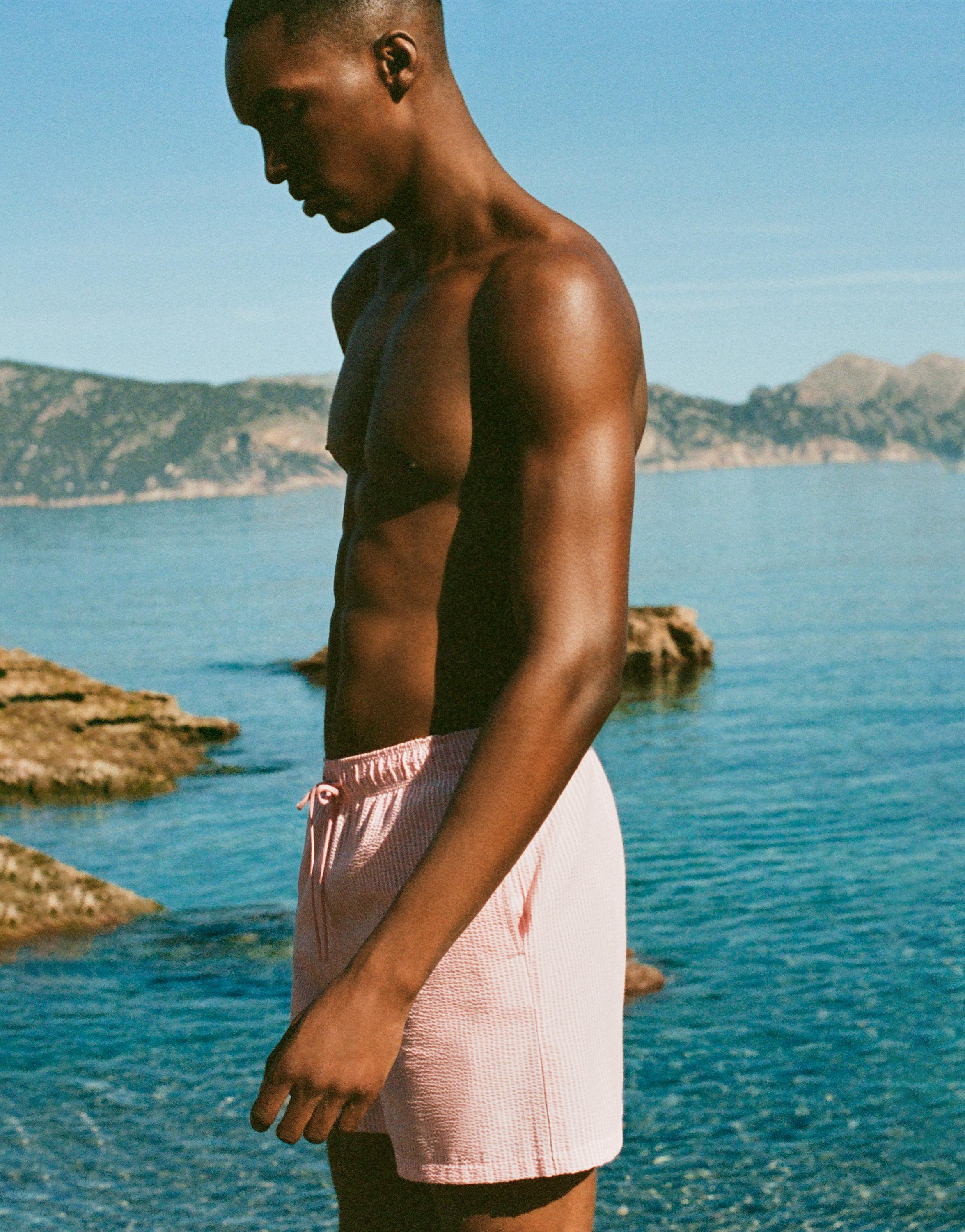 Striped seersucker swimming trunks — Pink