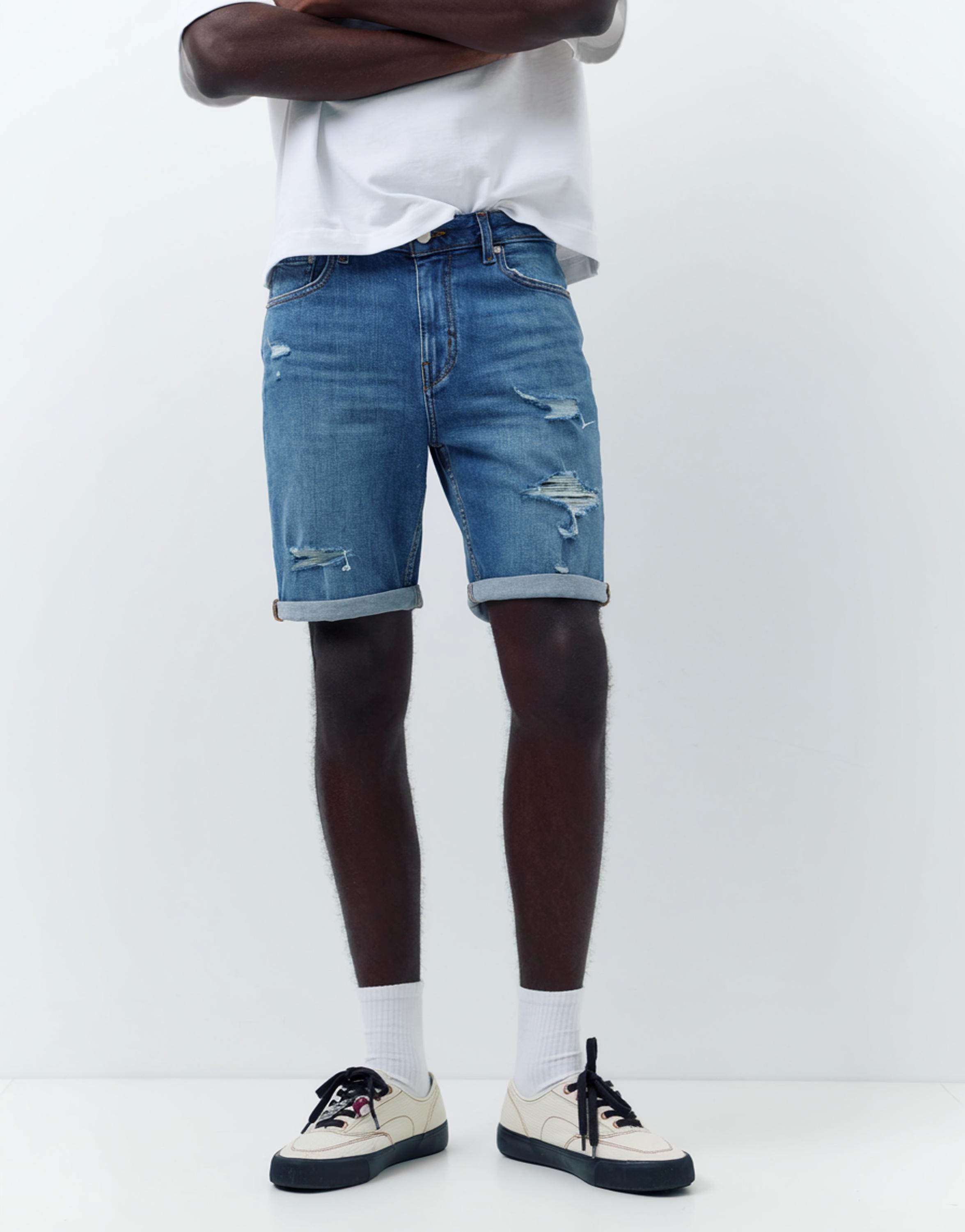 Ripped denim Bermuda shorts — Medium blue