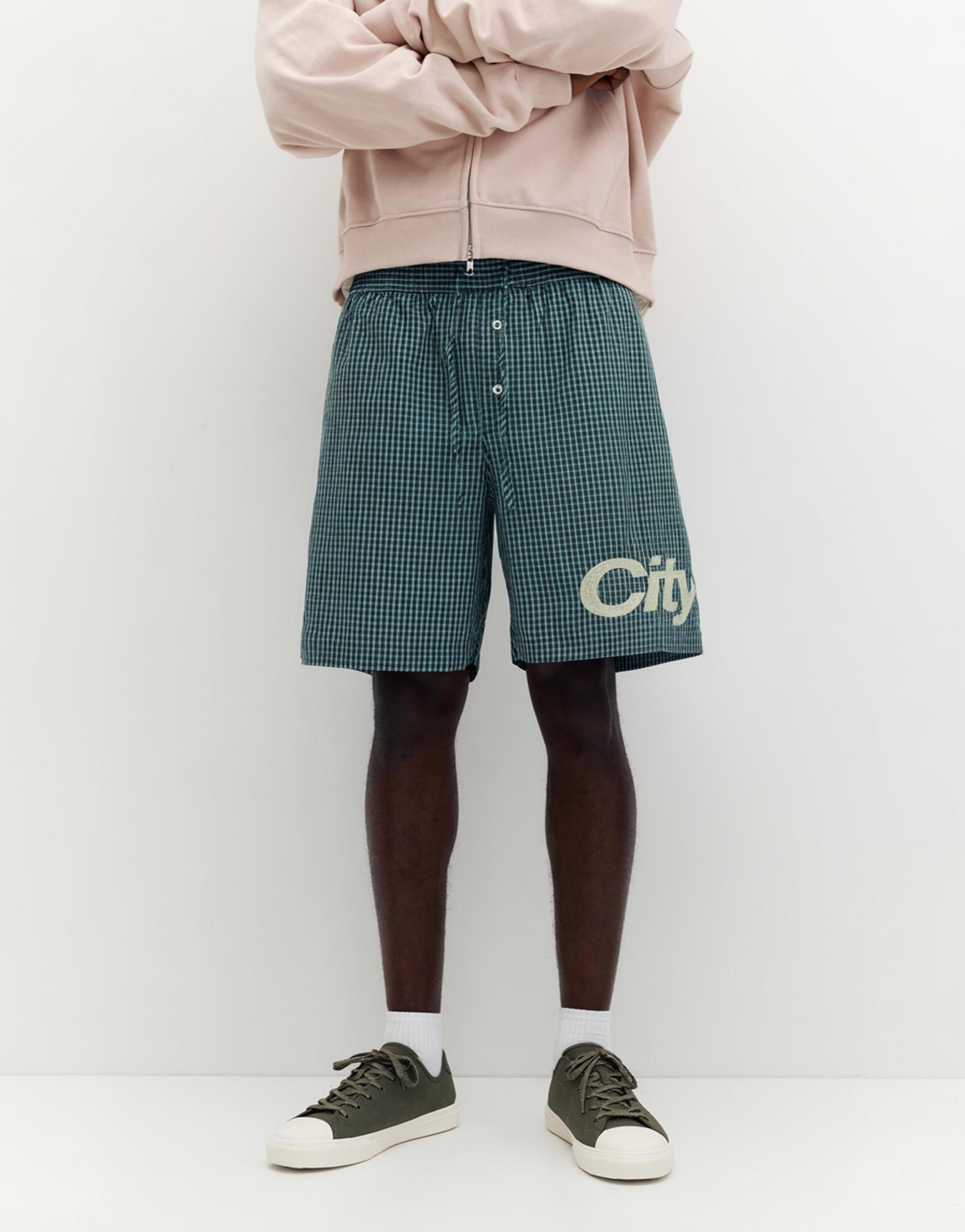 Checked graphic Bermuda shorts — Moss