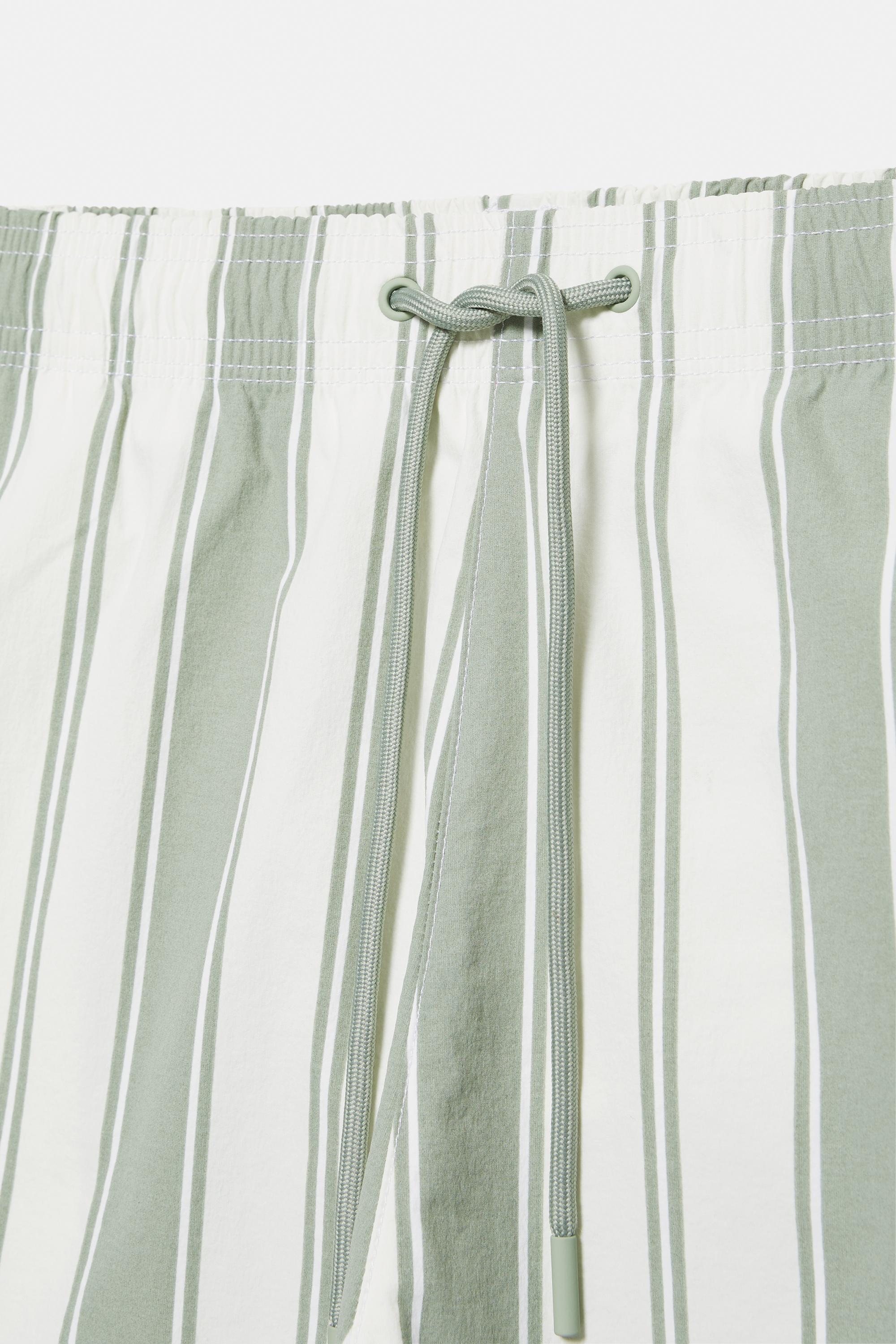 Striped board shorts — Green
