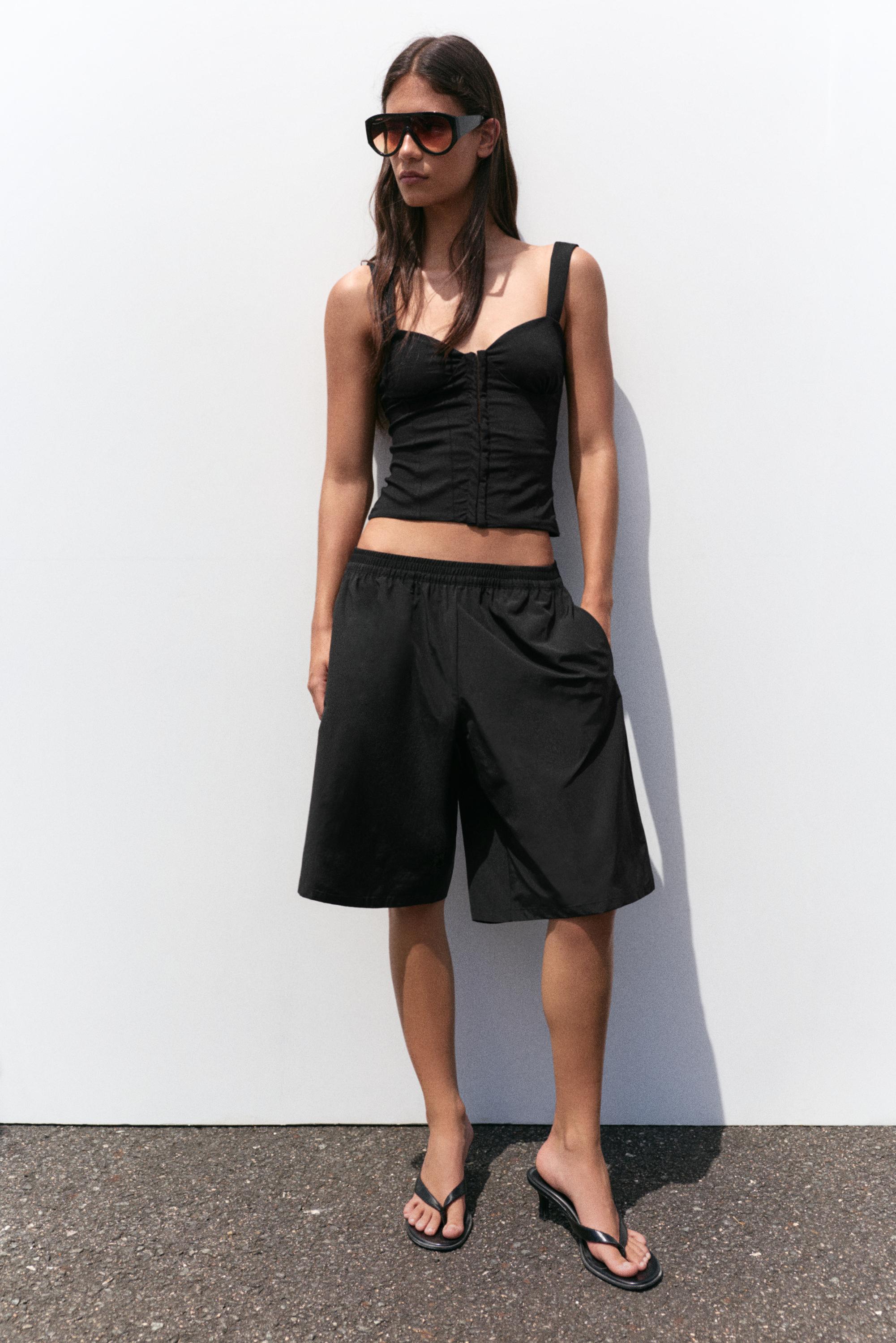 Strappy corsetry-inspired top — Black