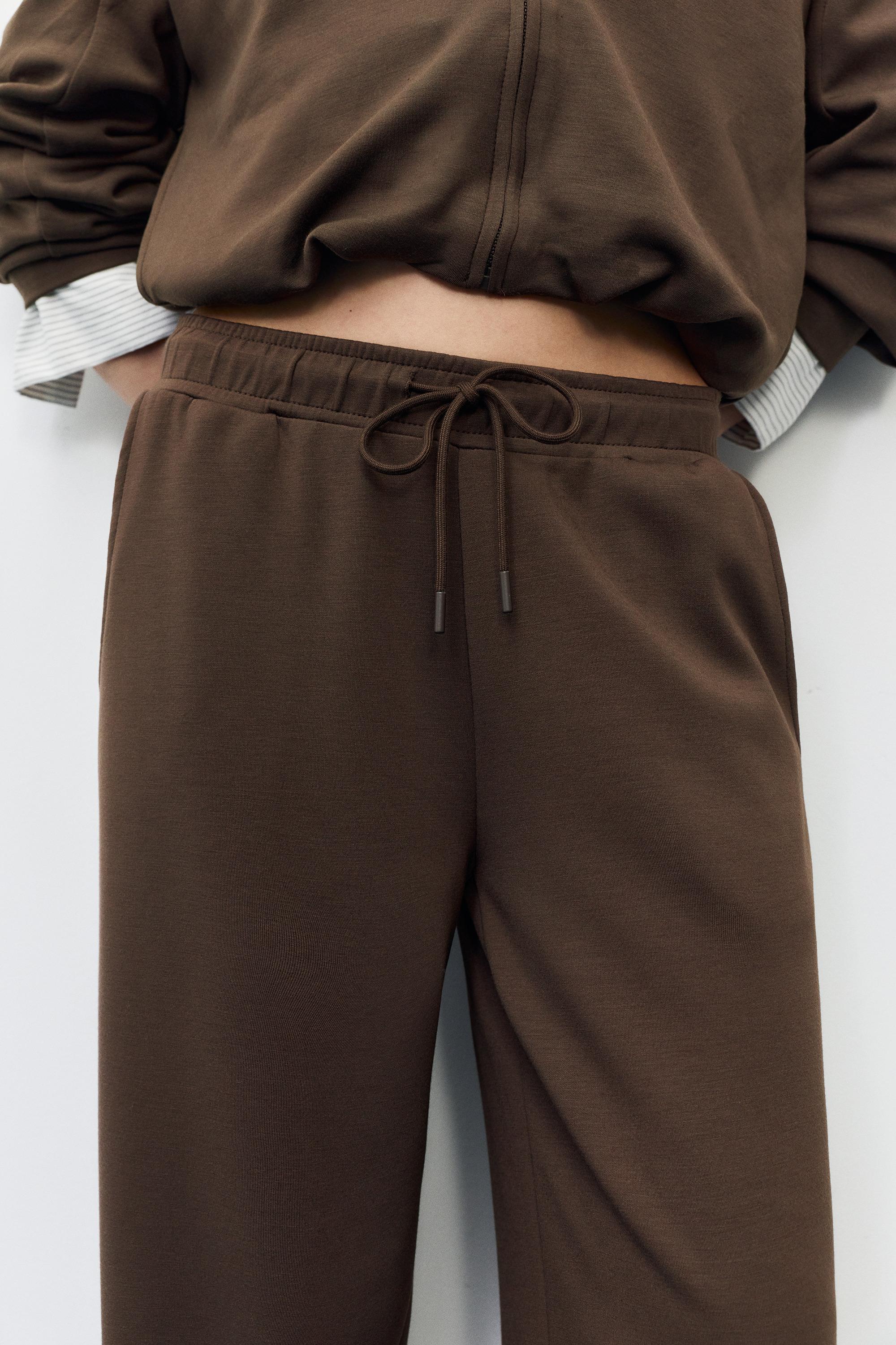 Soft-touch wide-leg trousers — Brown