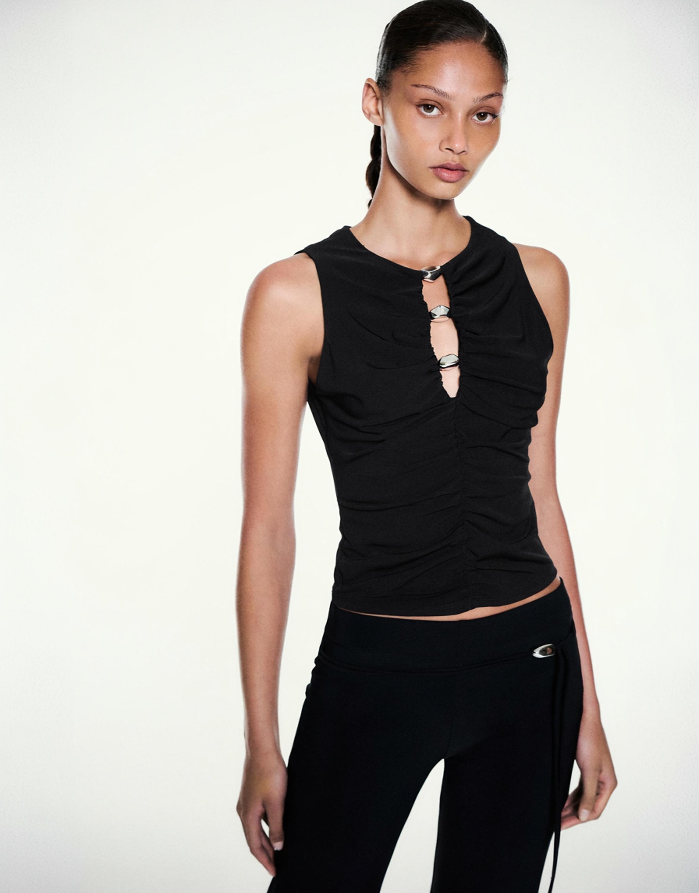 Cut-out embellished top — Black