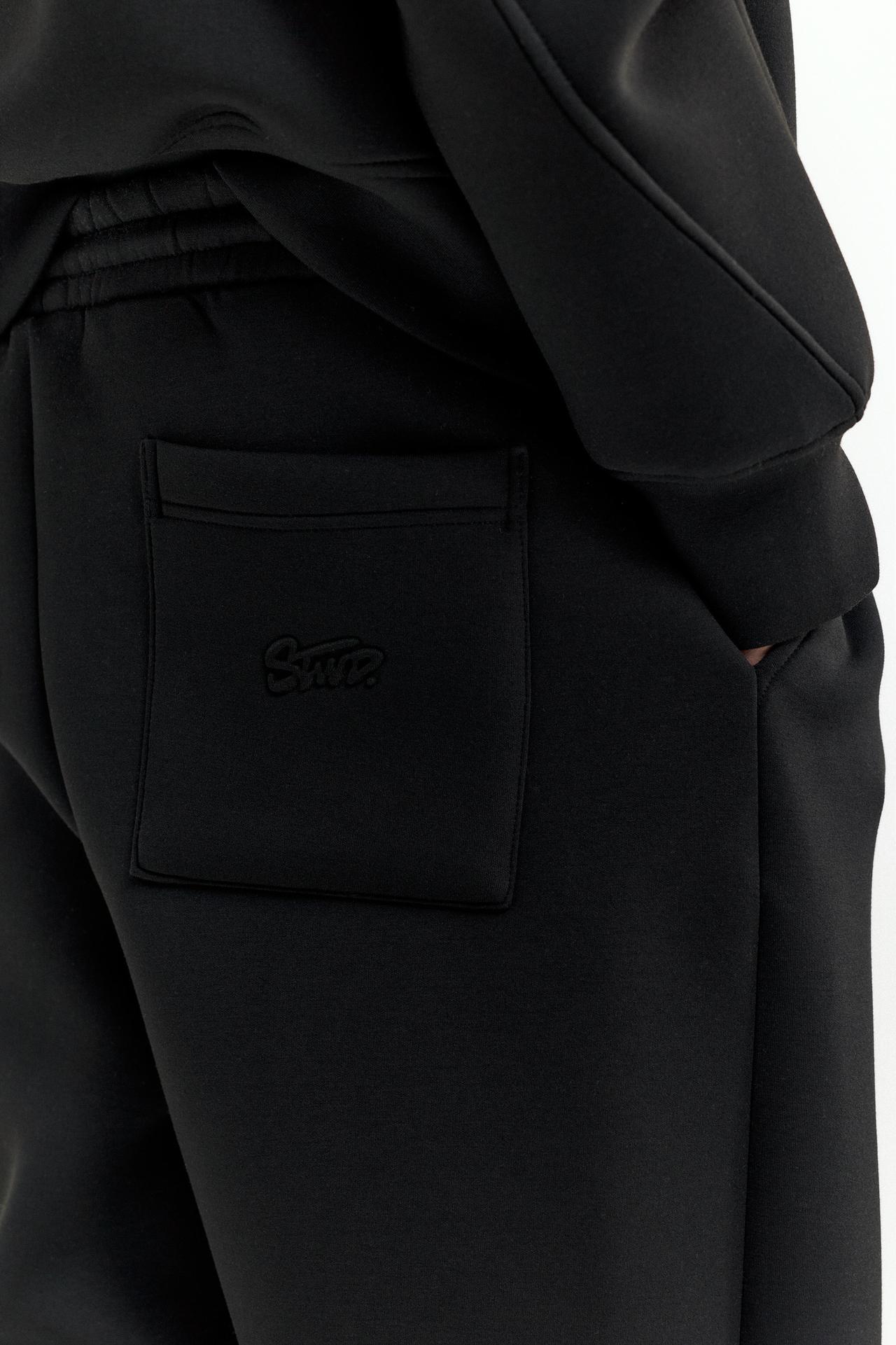 Neoprene-effect baggy trousers — Black