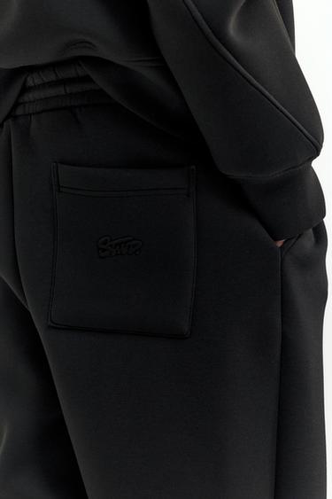 Neoprene-effect baggy trousers — Black 7