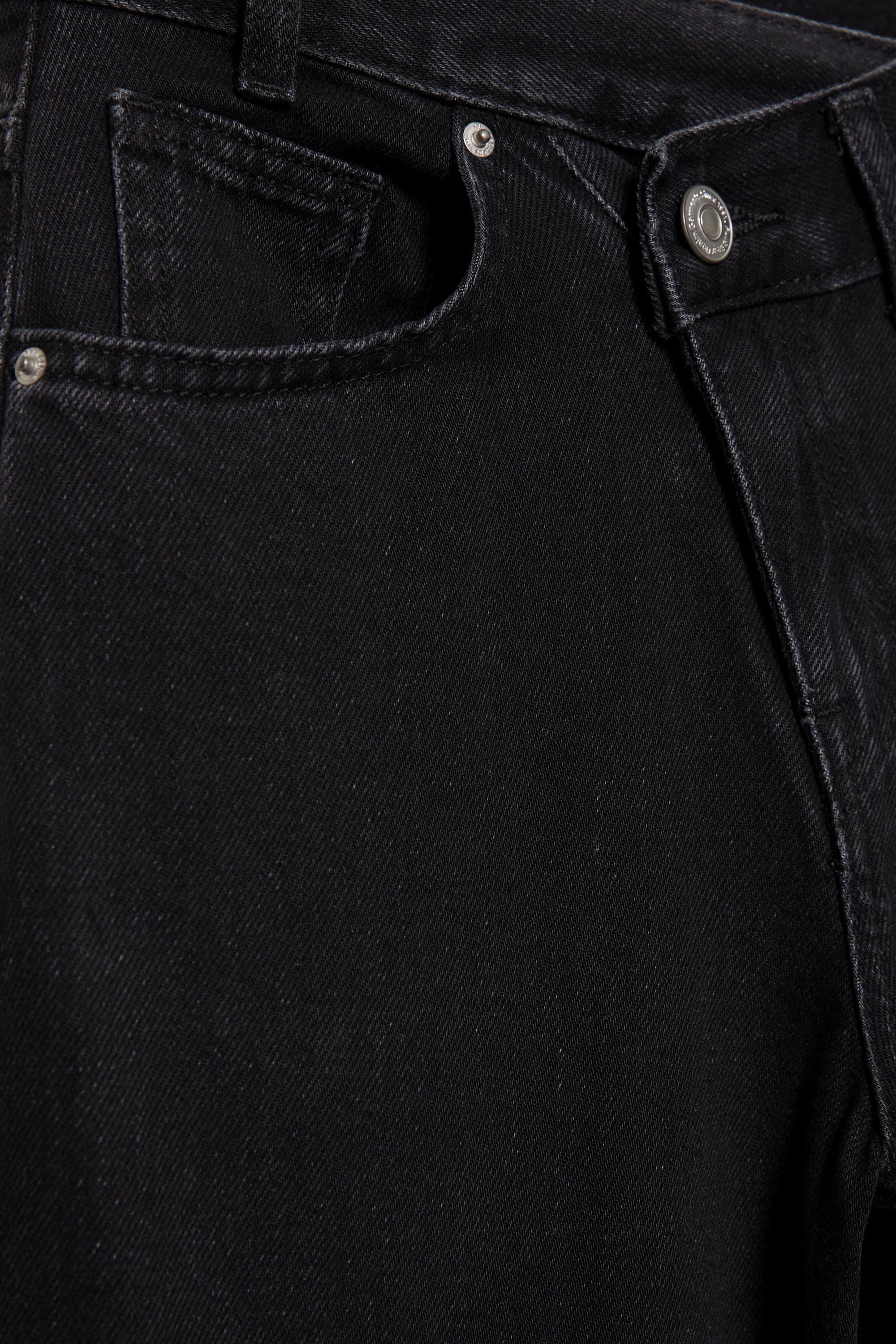 Çapraz kemerli geniş paça jean