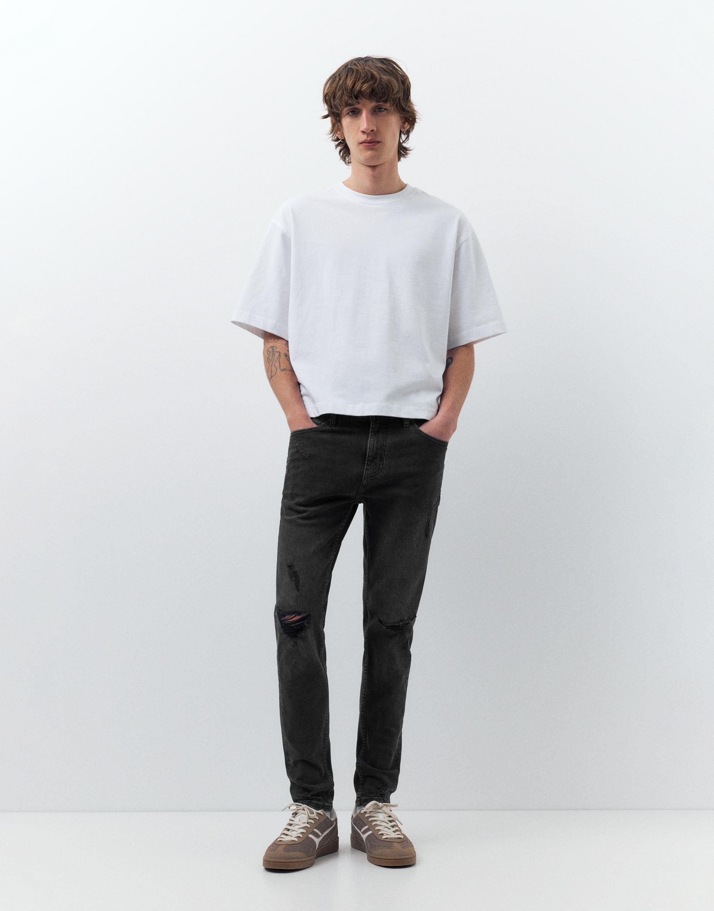 Ripped skinny jeans — Faded black