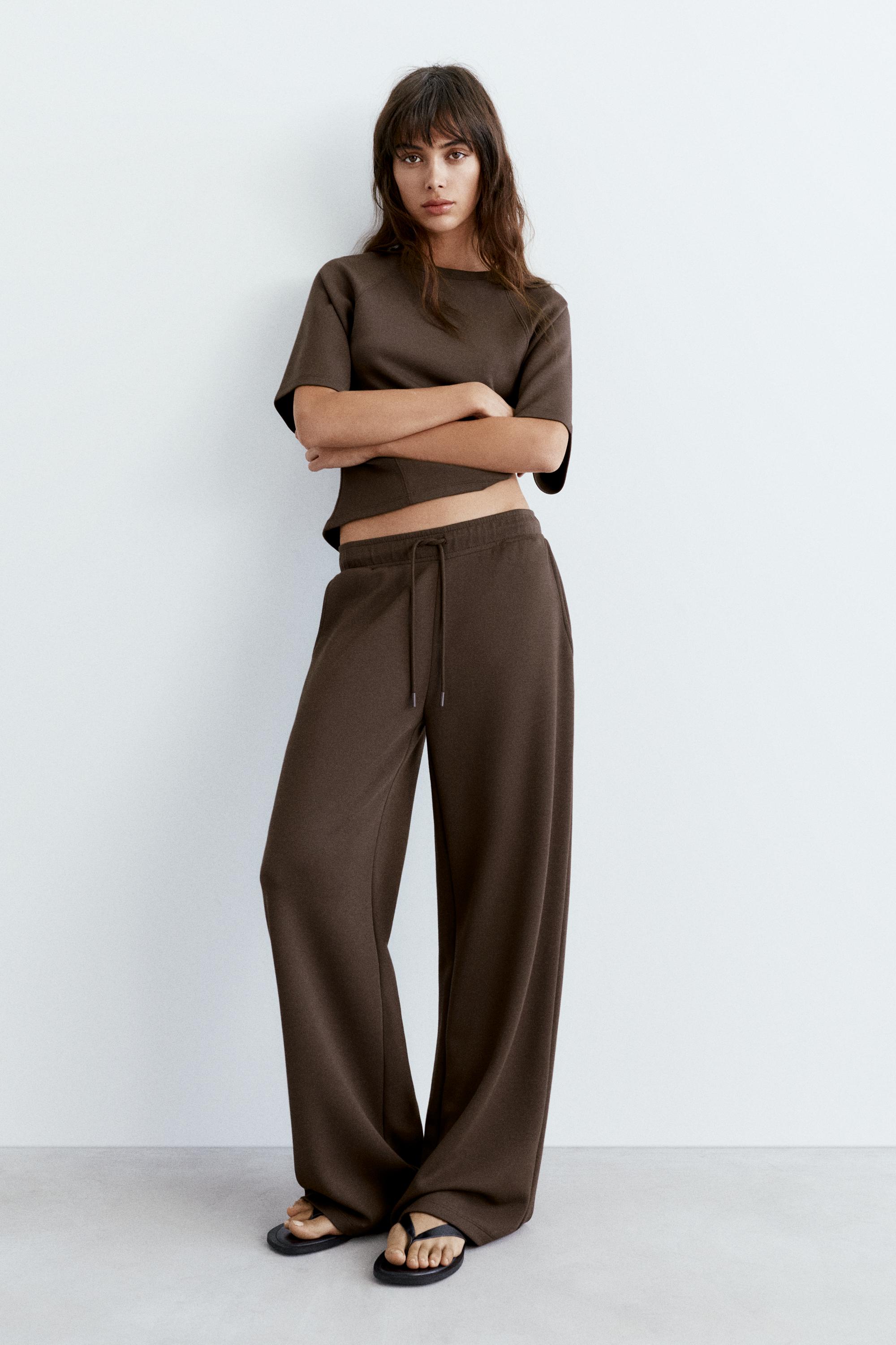Soft-touch wide-leg trousers — Brown