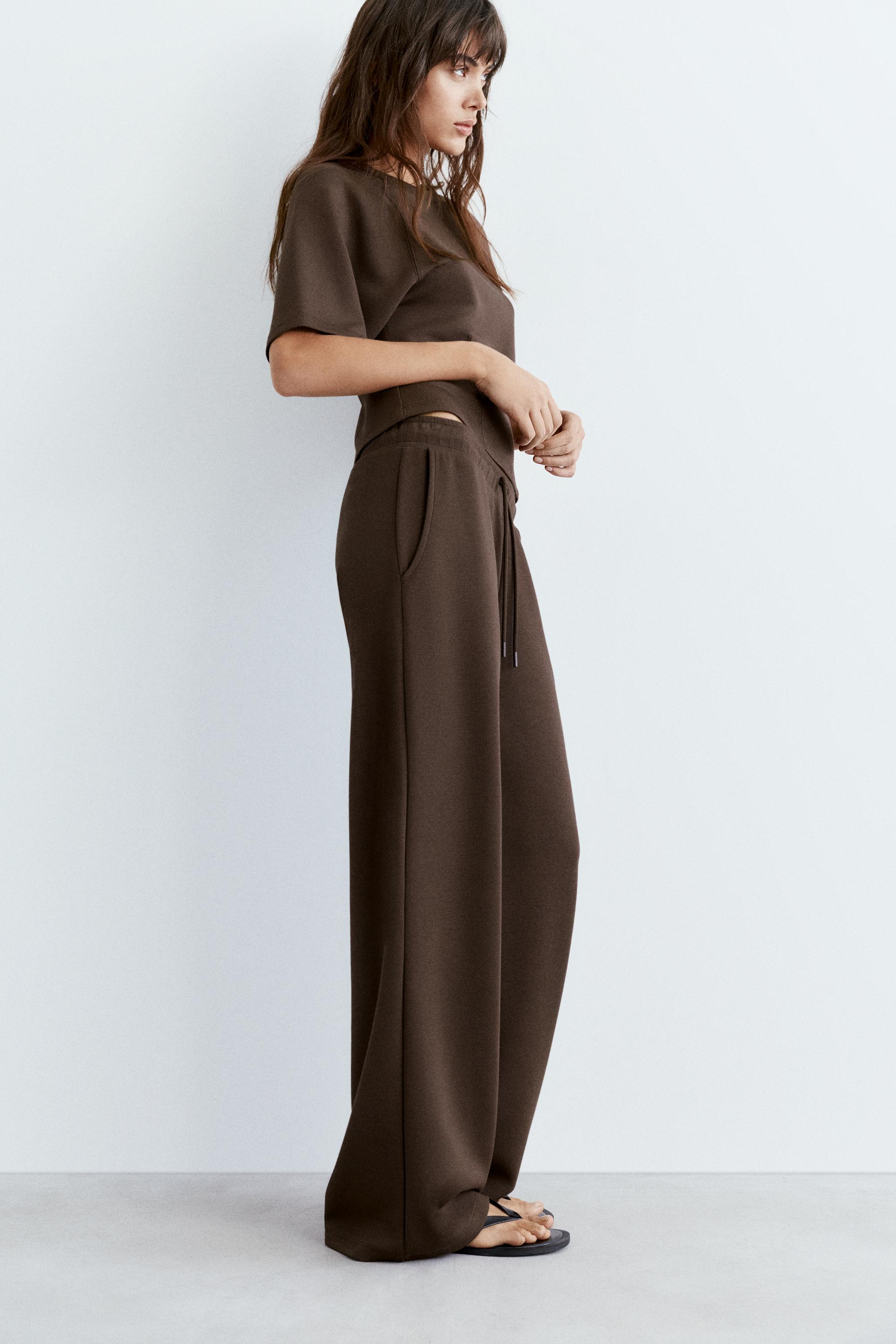 Soft-touch wide-leg trousers — Brown
