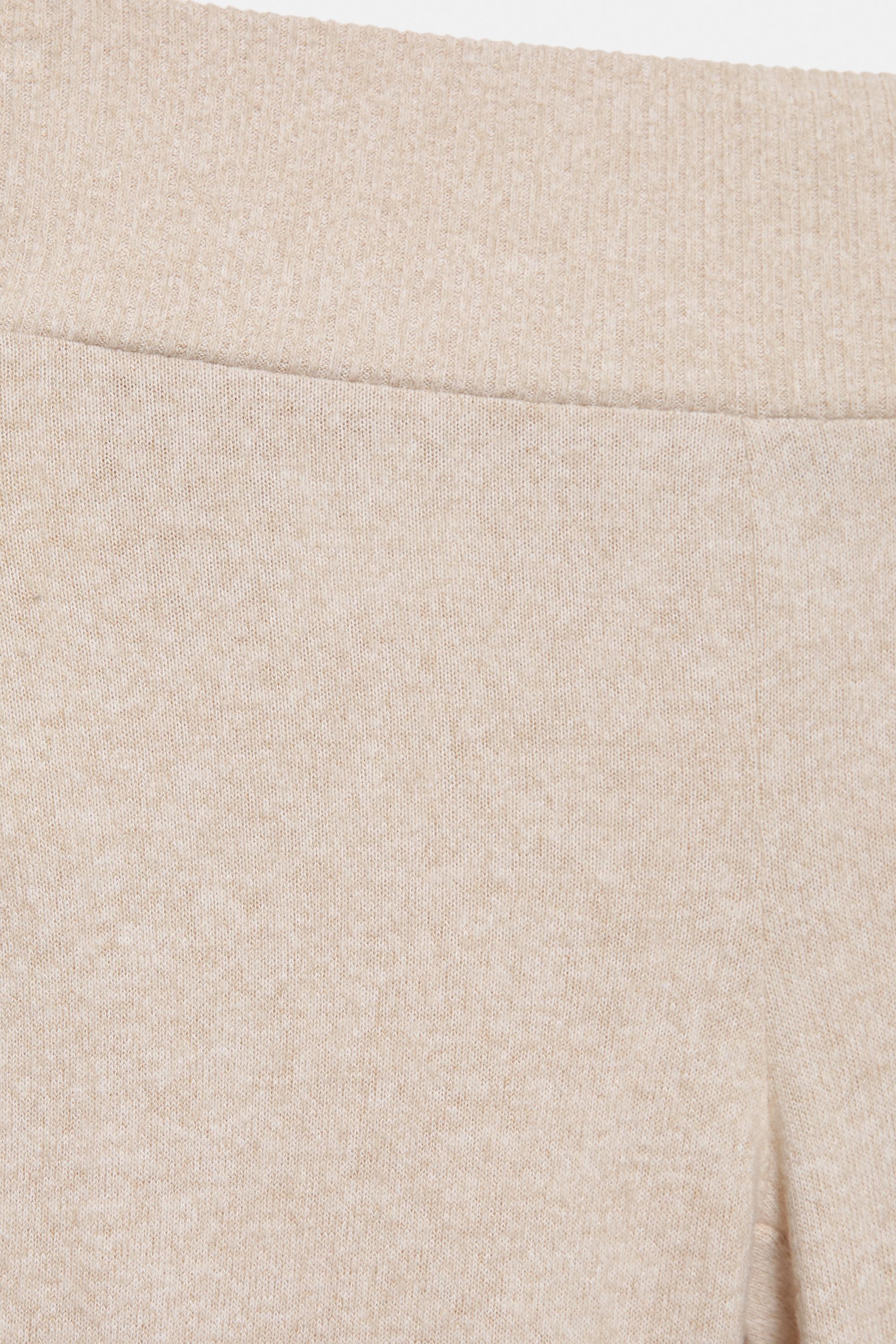 Soft touch flared trousers — Ecru