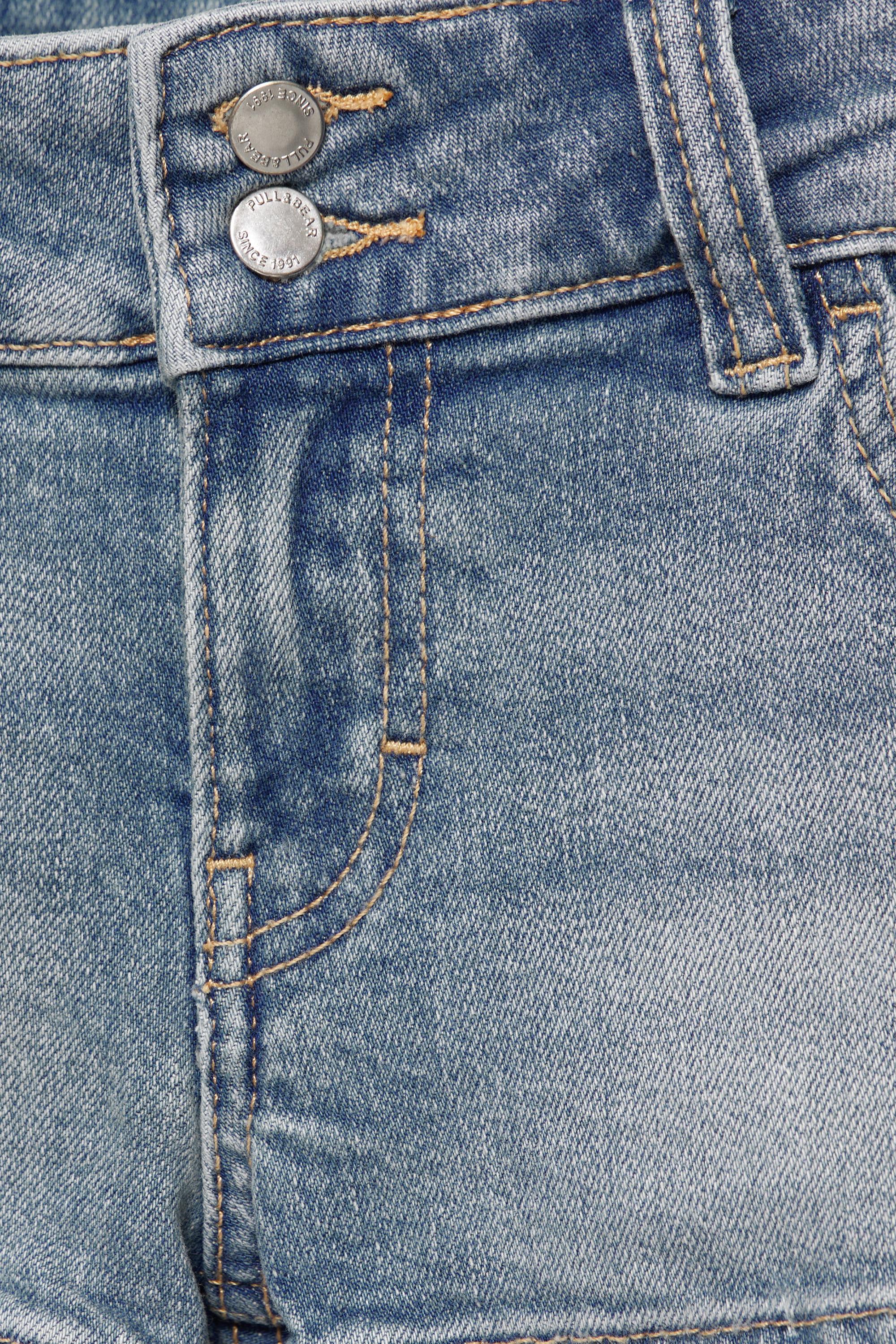 Double-button mini denim shorts — Pale blue