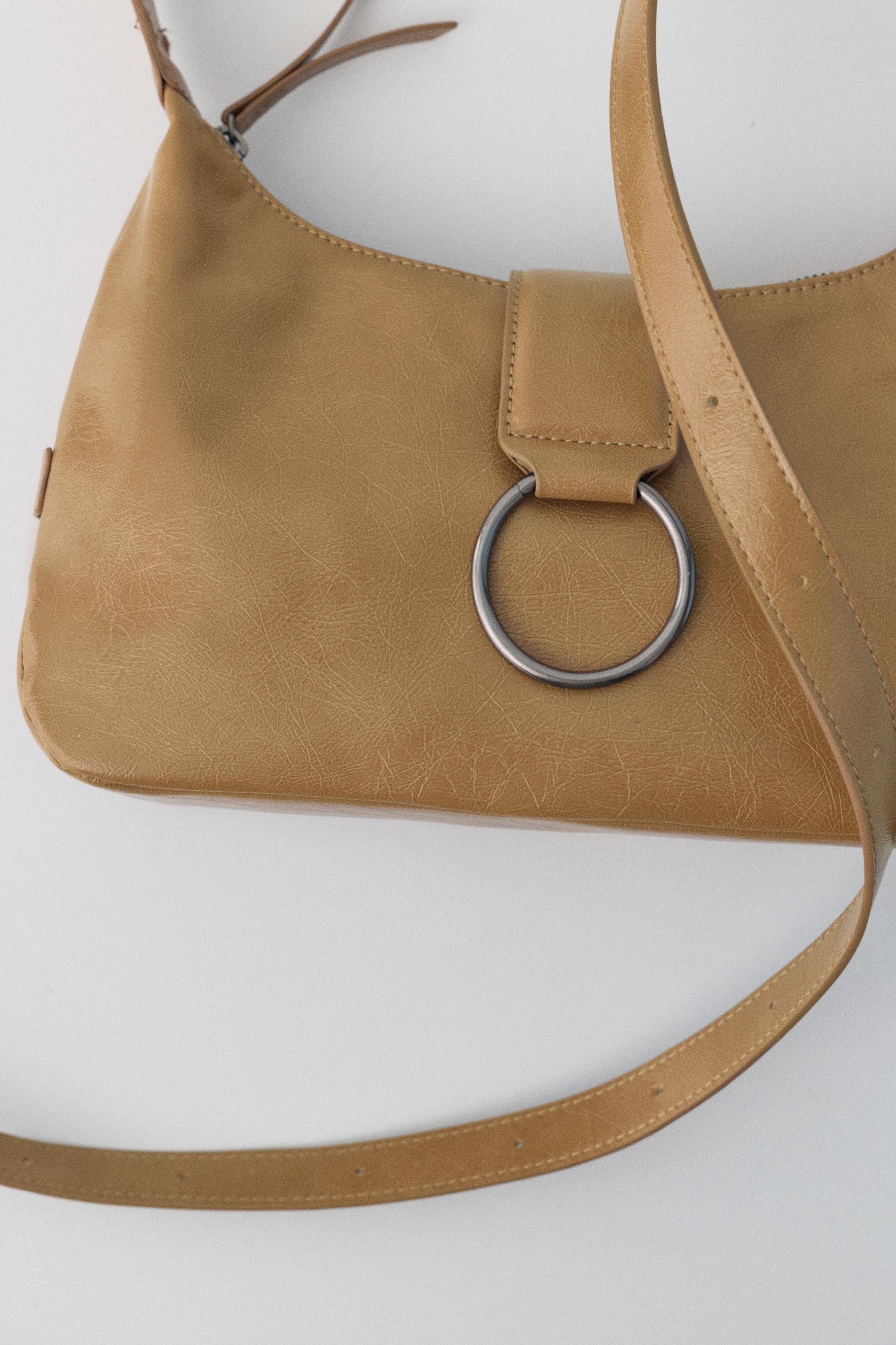 Crossbody bag with buckle — Leather