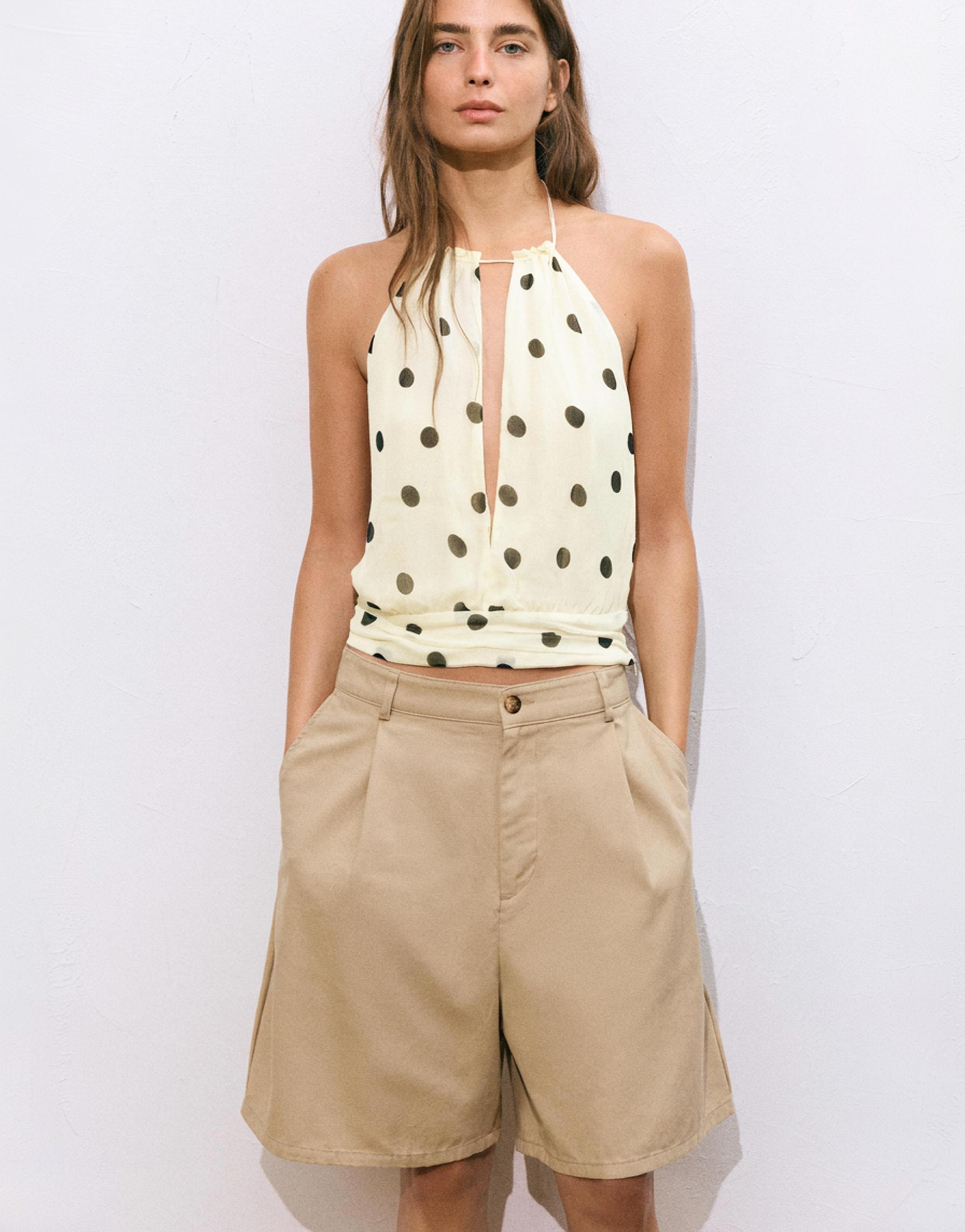 Polka dot halter top with cutout — White