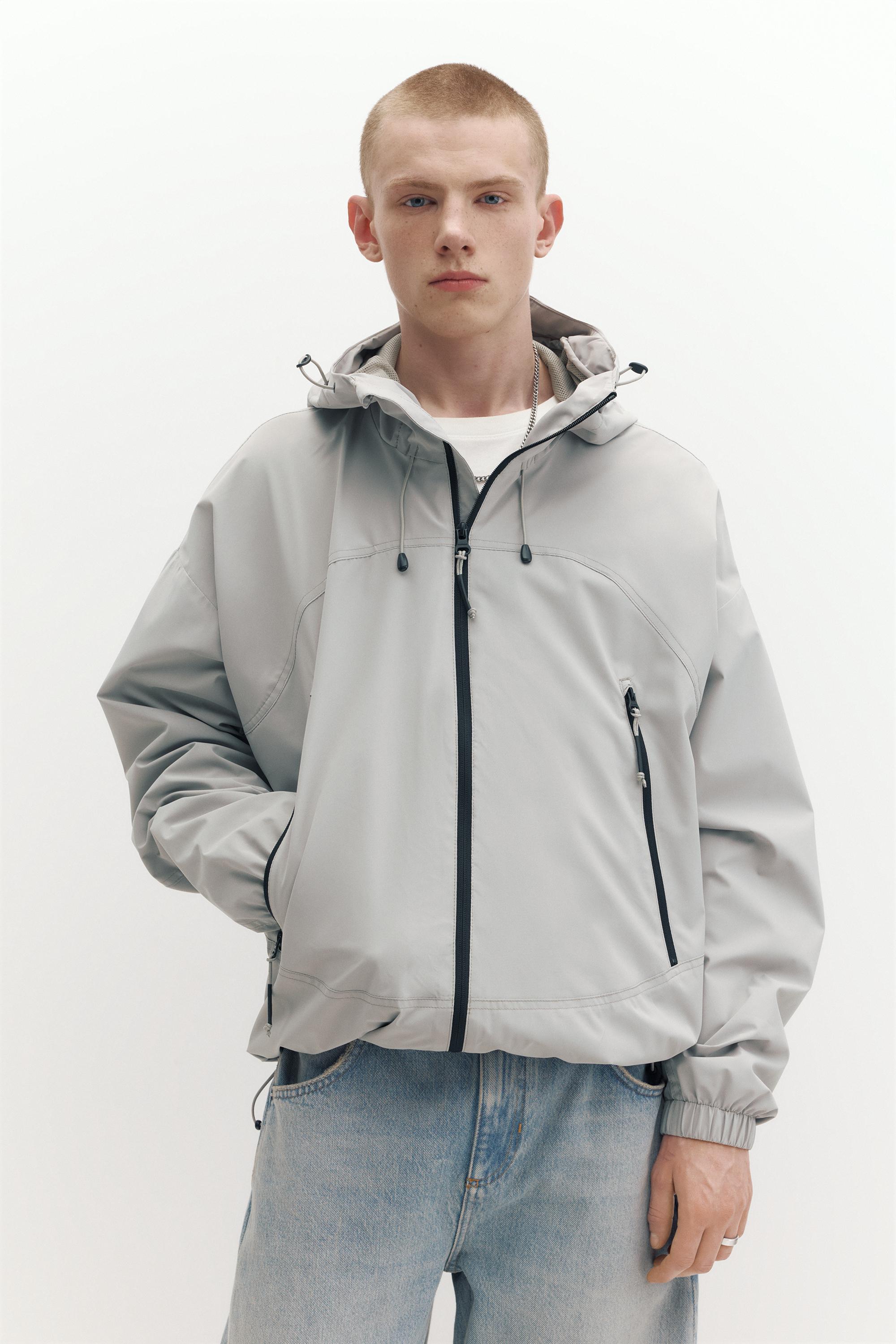 Lightweight hooded raincoat — Pale marl