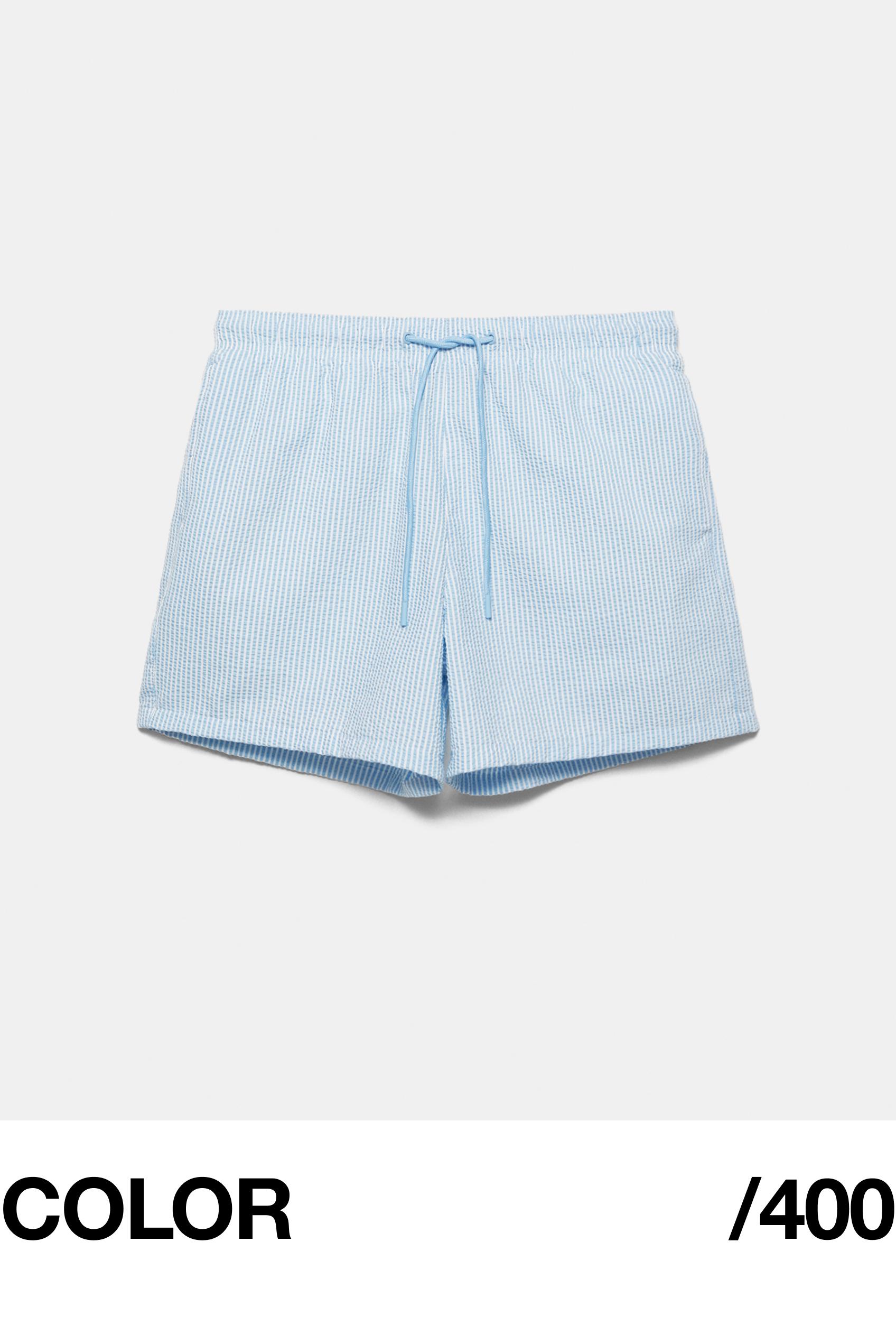 Striped seersucker swimming trunks — Blue