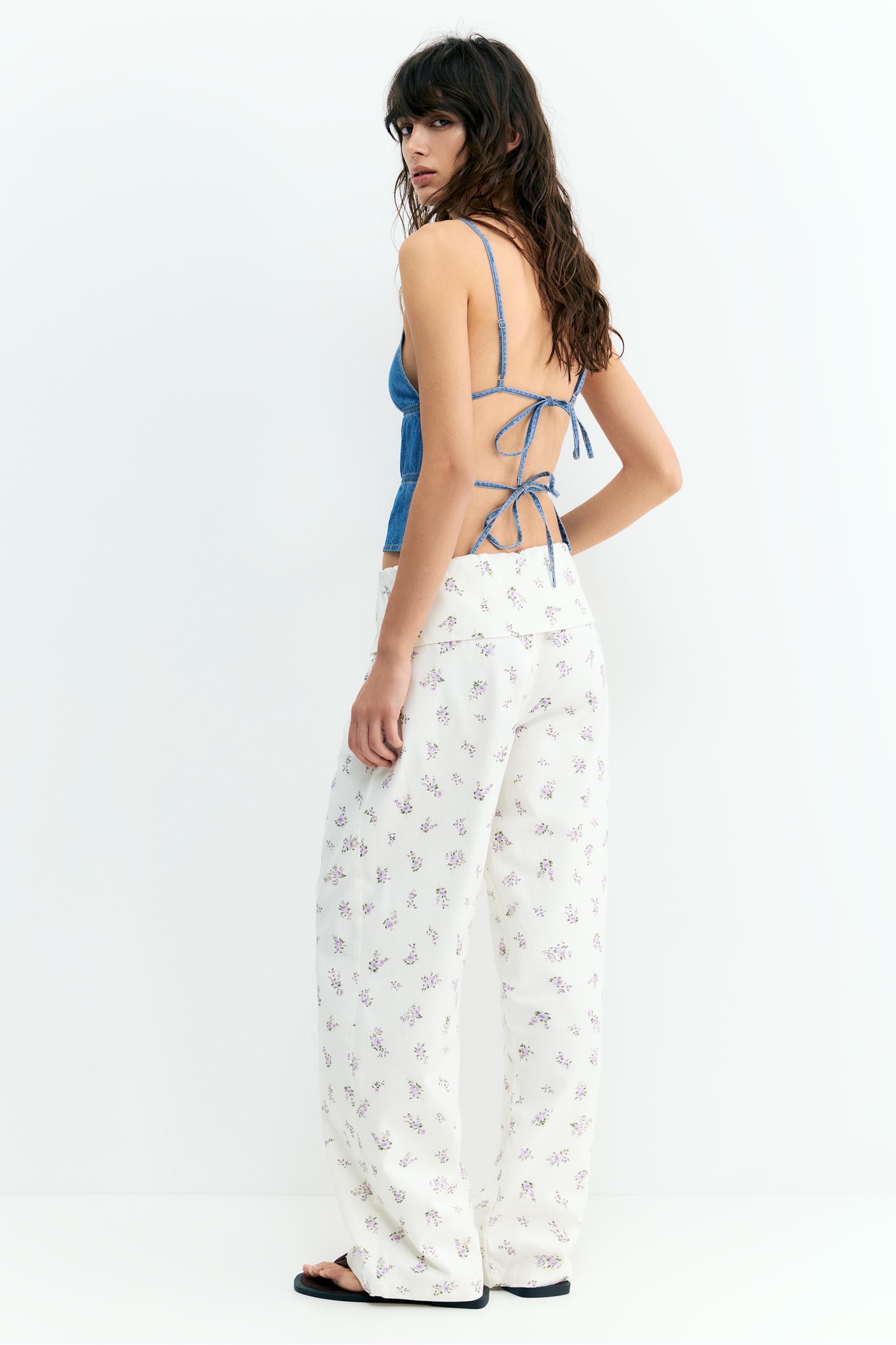 Floral trousers with turn-up waist — White