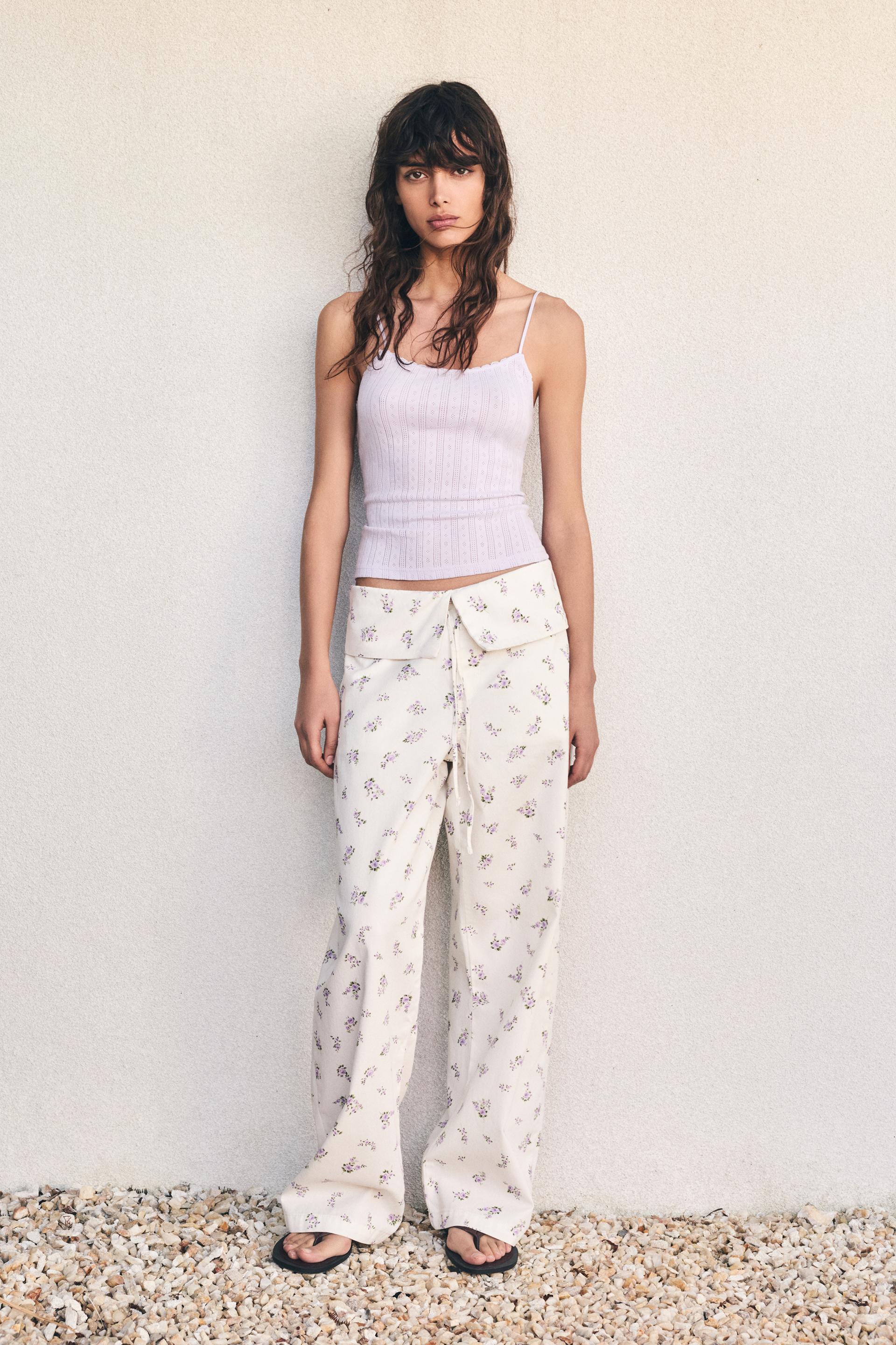 Floral trousers with turn-up waist — White
