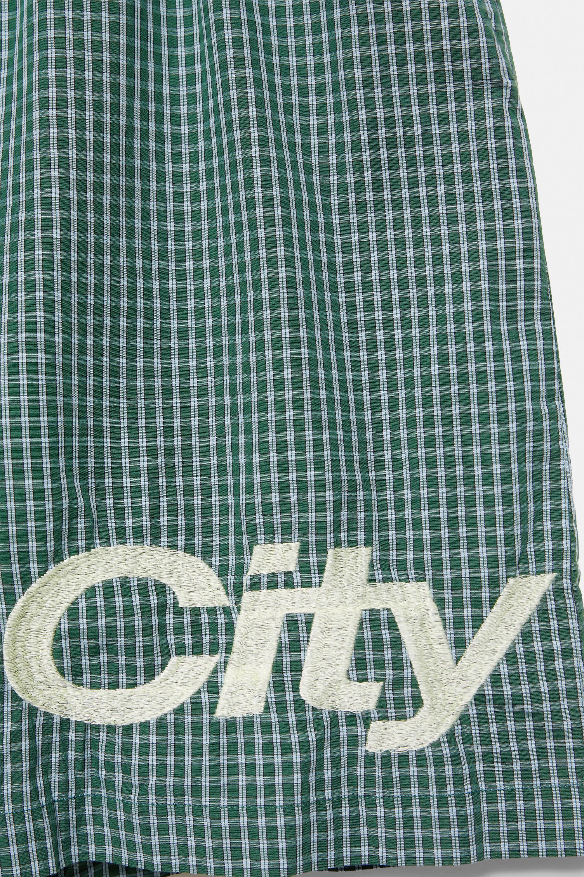 Checked graphic Bermuda shorts — Moss