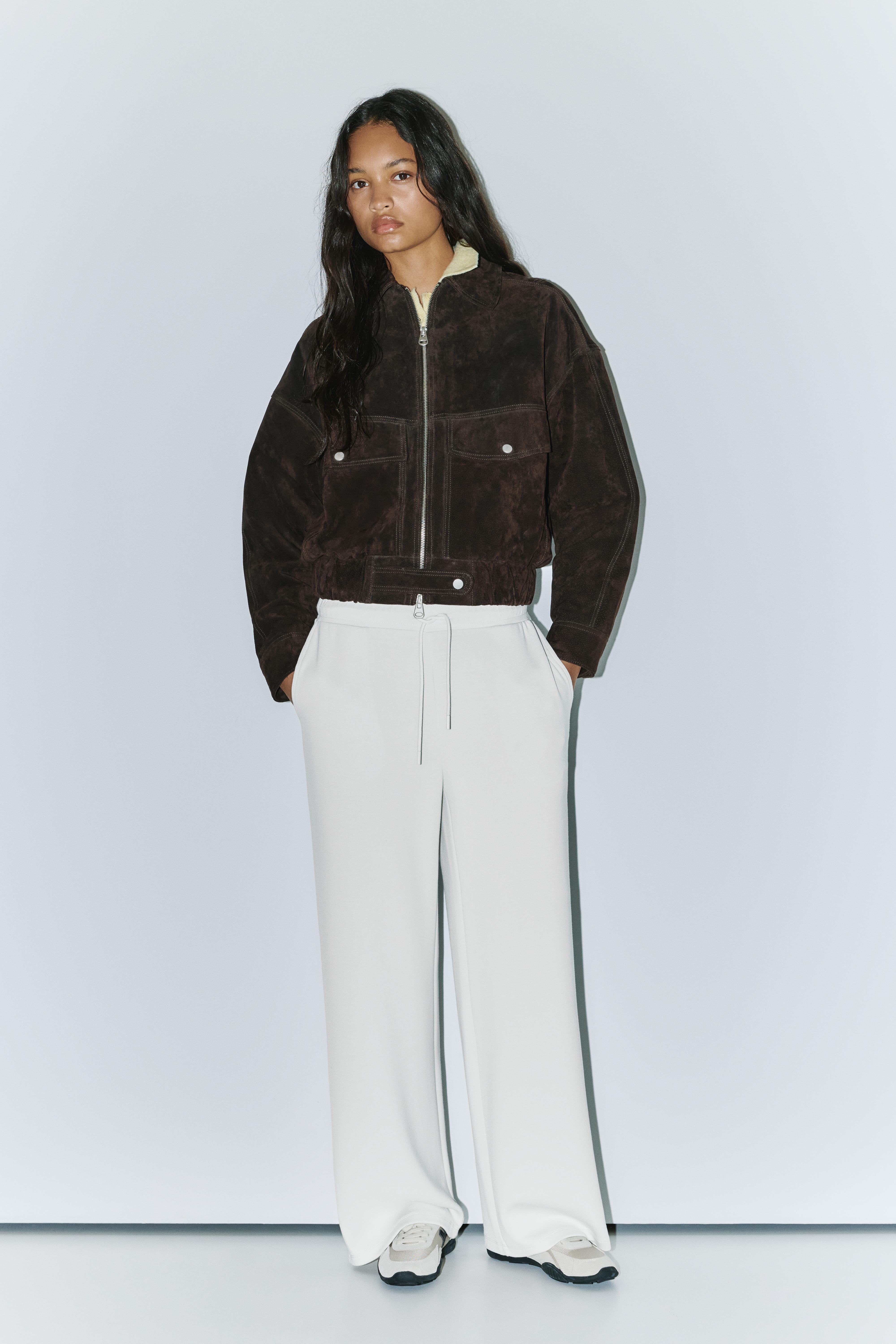 Soft-touch wide-leg trousers — Ecru