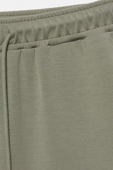 Soft-touch wide-leg trousers — Khaki 8