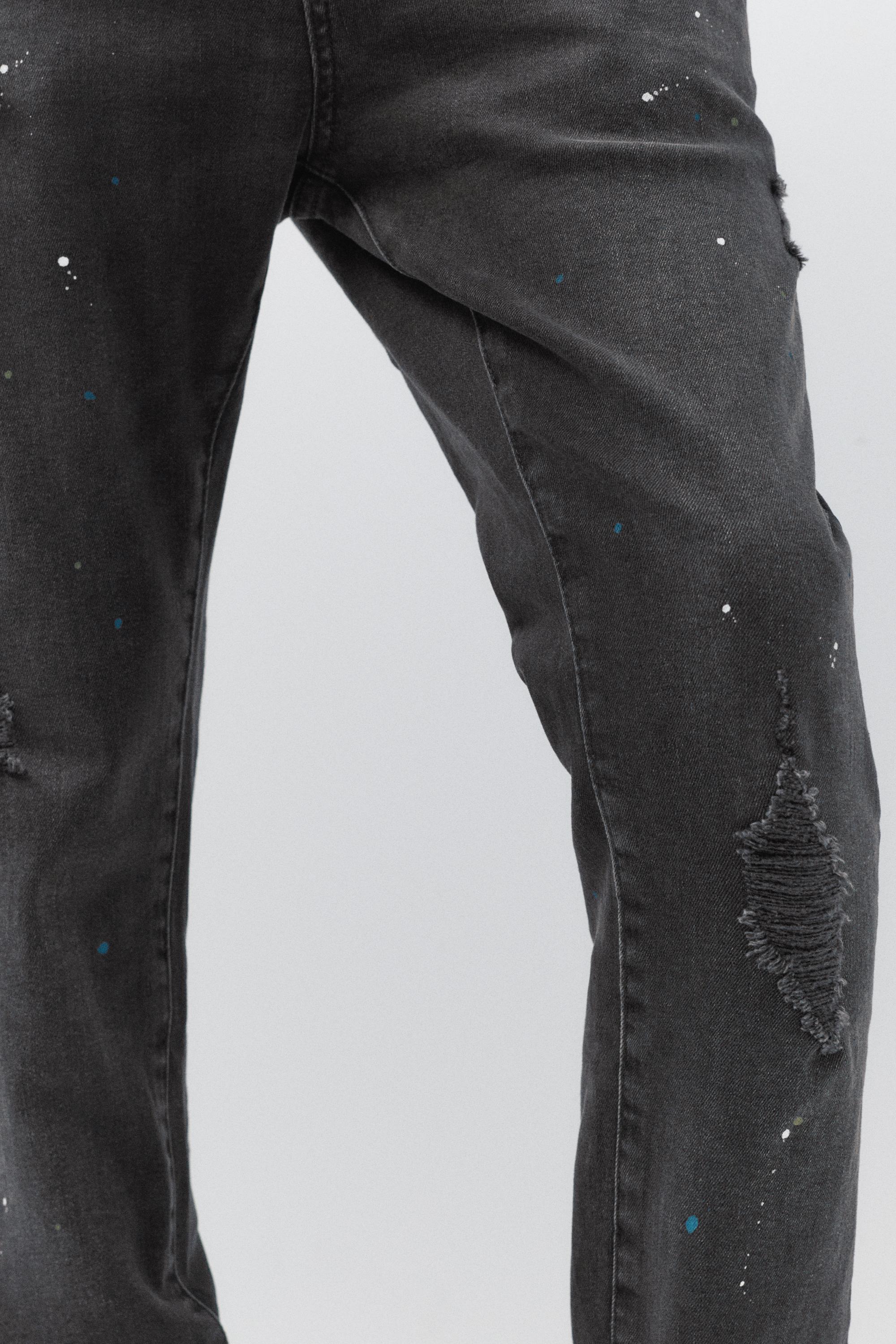 Paint splatter carrot-fit jeans — Faded black