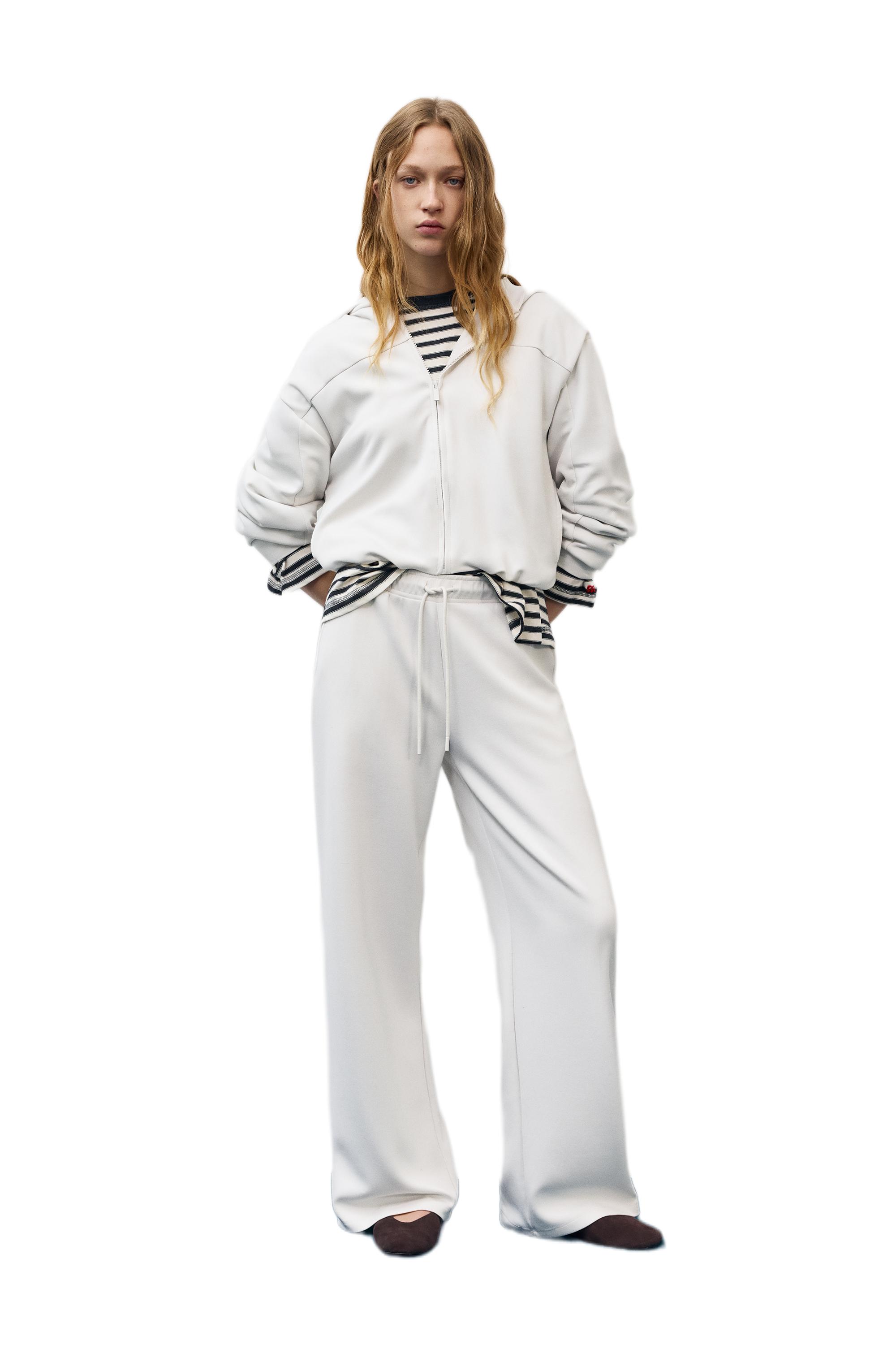 Soft-touch wide-leg trousers — Ecru