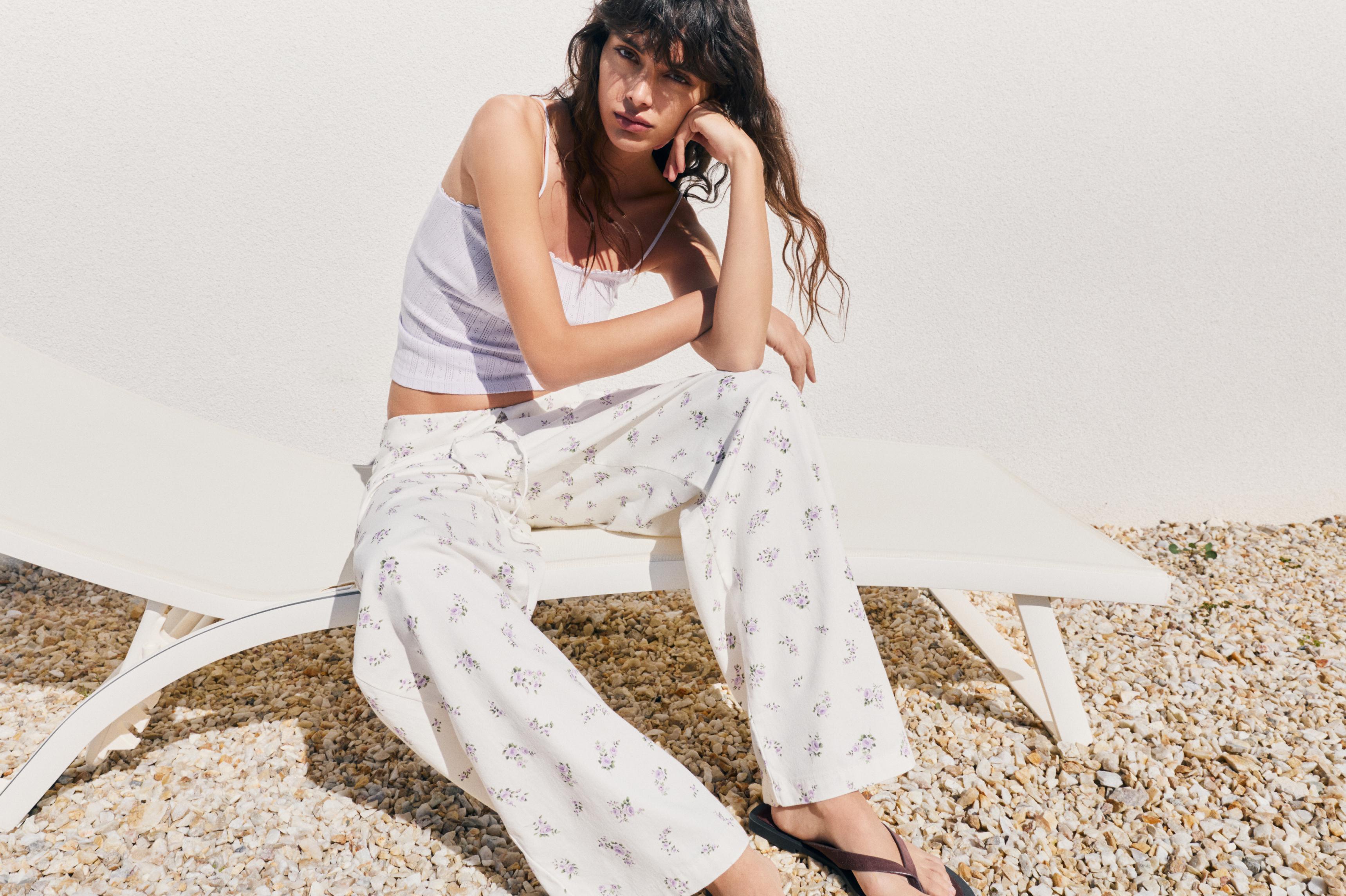 Floral trousers with turn-up waist — White