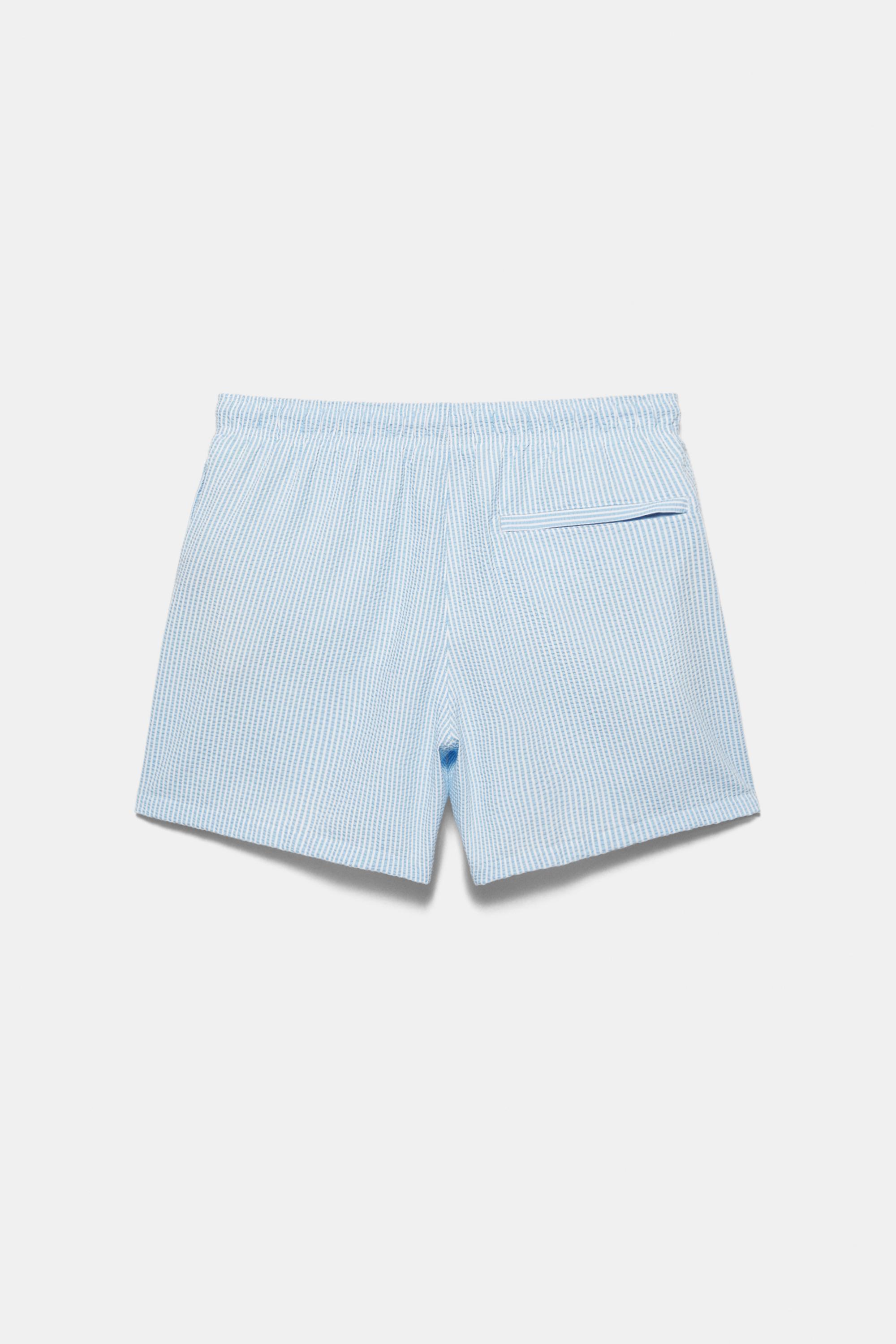 Striped seersucker swimming trunks — Blue